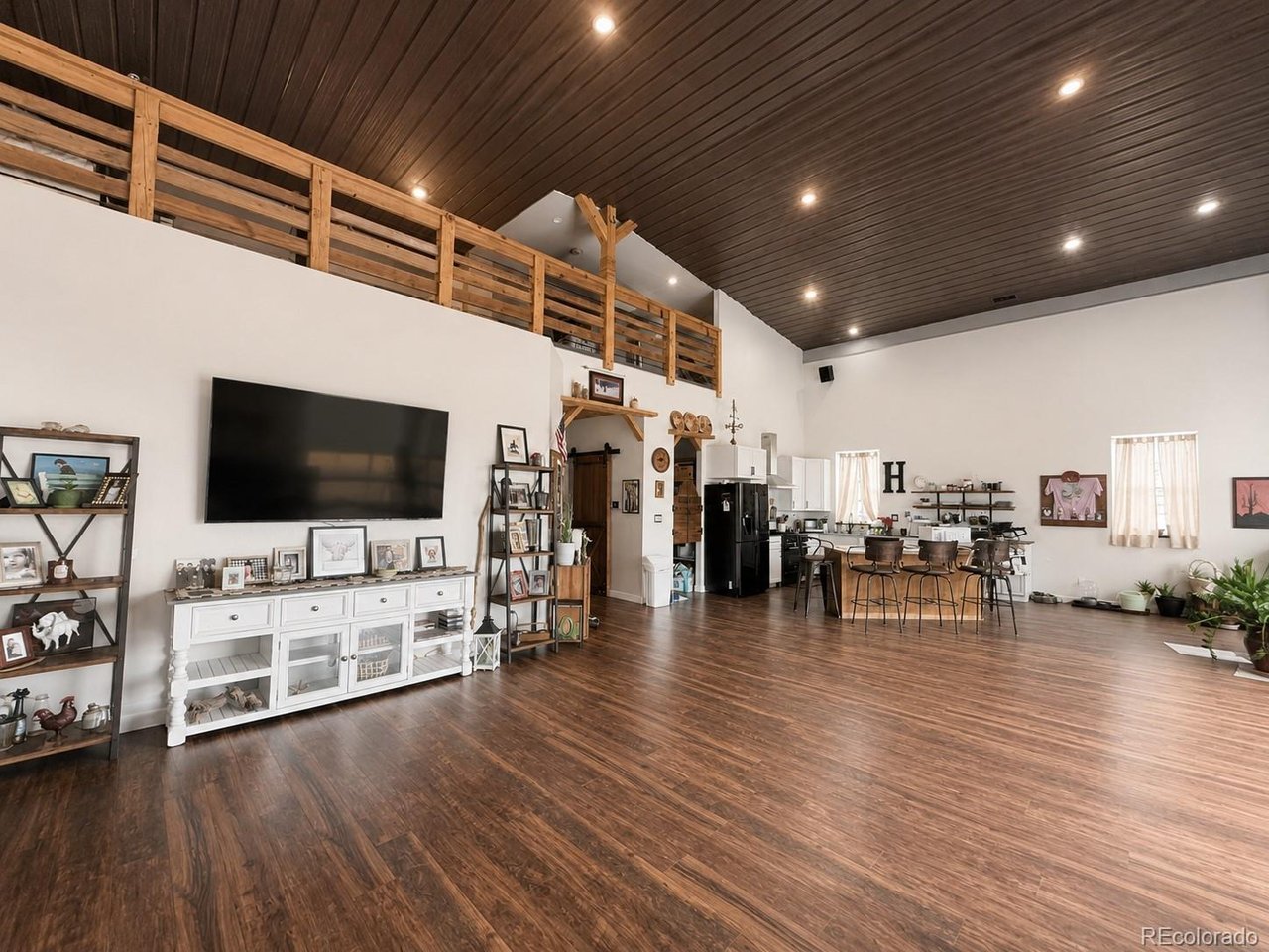 Custom-built 2,600-square-foot barndominium situated on 37 acres. This thoughtfully designed home features a spacious open floor plan with quality craftsmanship throughout, including custom doors, cabinets, countertops, and extensive live-edge wood accents. The main living area is highlighted by a large roll-up door that opens to a spacious patio, creating seamless indoor-outdoor living and taking advantage of the property's views overlooking the surrounding valley.Additional features include high-end flooring, well-appointed bathrooms, smart appliances, solar panels, and a 1,500-gallon cistern system. The home also includes a garage for additional storage and workspace. Conveniently located near the highway for easy access while maintaining privacy and unobstructed views, this custom-built property offers 37 acres of land and a one-of-a-kind living experience.