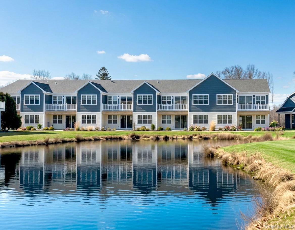 Experience refined, low-maintenance living in this beautifully designed new construction condo at Beechwood at The Waterways, a private gated 55+ waterfront community in Moriches. The Devon offers approximately 1,874 square feet of thoughtfully designed living space with 2 bedrooms, 3 full bathrooms, and a spacious loft. The first floor welcomes you with a covered entry porch, inviting foyer, and private attached one-car garage.The main living level showcases an open-concept design highlighted by a dramatic vaulted ceiling and abundant natural light. A gourmet kitchen with a center island flows seamlessly into the dining area and expansive great room with a fireplace, while a private balcony extends the living space outdoors. The spacious primary suite features dual closets and an en-suite bathroom. A secondary bedroom, flexible bonus space ideal for a home office or den, convenient laundry area, and an additional full bathroom complete this level.The third-floor loft offers exceptional versatility as a media room, home office, fitness space, or guest retreat while overlooking the living area below. A convenient third full bathroom adds flexibility for everyday living and entertaining. Additional highlights include generous storage throughout and thoughtfully designed spaces that enhance both comfort and functionality.Residents enjoy exceptional resort-style amenities including a private clubhouse, waterfront pool and sundeck, private marina, tennis and bocce courts, and beautifully landscaped walking paths. Ideally located near beaches, shopping, dining, golf, and the best of Long Island's South Shore, Beechwood at The Waterways offers the perfect blend of waterfront tranquility, modern comfort, and an active 55+ lifestyle.Sale may be subject to terms & conditions of an offering plan. Purchaser will receive offering plan for verification of monthly maintenance charges and financial information at time of purchase (actual fees may vary).Attached images may be renderings or AI enhanced photos.