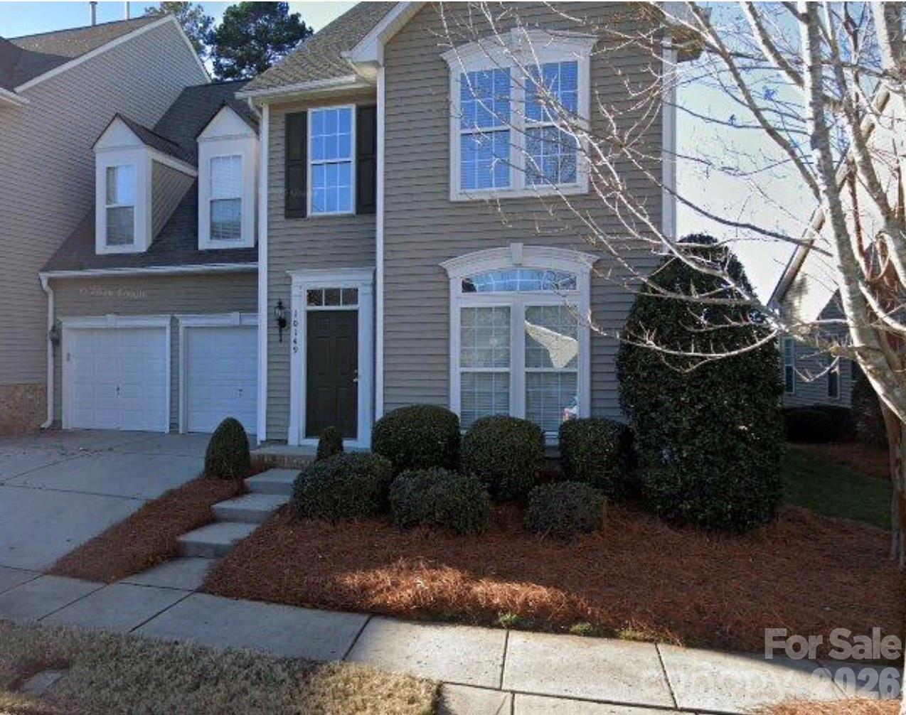 Perched along the Skybrook Golf Driving Range, this spacious townhome offers a lifestyle that feels both relaxed and refined.  Enclosed back deck is perfect for Grilling and dining out in private back yard surrounded by trees! The heart of the home is a chef's kitchen designed for gathering, featuring a gas cooktop, double ovens, and a butler's pantry that makes entertaining effortless. Sunlight fills the open floor plan, highlighting rich hardwood floors and freshly painted walls that provide a beautiful backdrop for your personal style.Main Floor primary suite offers a serene retreat, while the upstairs loft provides flexible space for a home office, reading nook, fitness area, or playroom. Live where every day feels like a getaway. Conveniently located just minutes from Concord Mills, dining, entertainment, and major commuter routes including I-85 and I-485, this home delivers exceptional value, convenience, and lifestyle. The opportunity you've been waiting for is here.