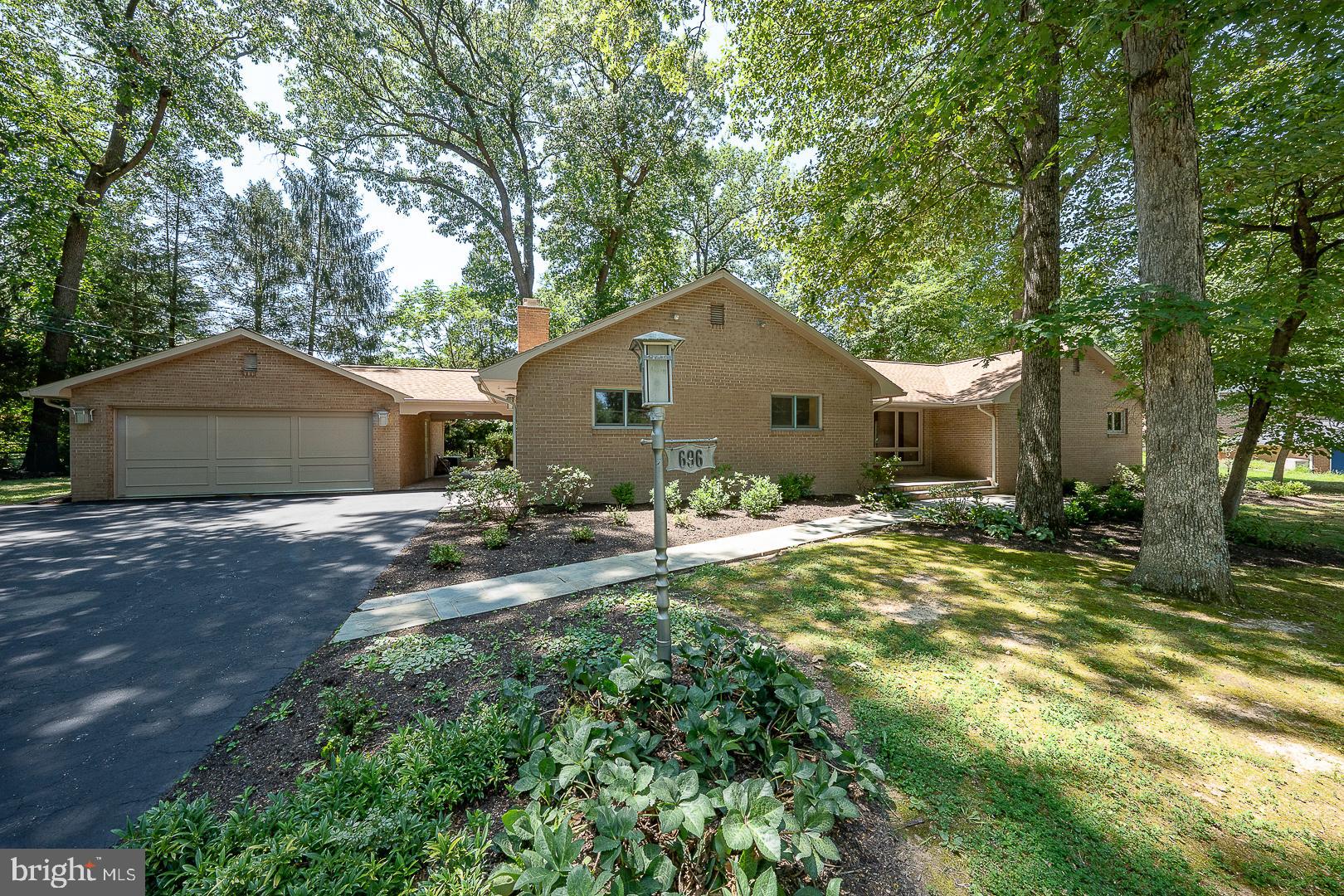 Prime location for this 3BR, 2.5BA Mid-Century Modern Contemporary home, located on a quiet corner in the heart of Upper Merion Township. Come take a look at the lush .59 acre wooded views this southern exposure gem has to offer. The wide open floor plan along with the large glass windows  offer a ton of natural light to pour into every room. Spacious living room & dining room with Murano Glass fixtures, Walnut hardwood floors and contemporary touches makes visitors feel welcome. The Eat-in kitchen with ceramic tile floor, and solid surface countertops, flows into the Laundry room, powder room, and entry to the breezeway to paver concrete patio. The bedroom wing has a master Bedroom suite with a full bath and closet, 2 additional bedrooms, hall bath, & linen closet.  1st floor family room with stone fireplace, powder room and sliders to the outside patio. There is a full basement for storage or expansion.  The oversized 2-car garage is just across the breezeway, Upper Merion schools, easy access to many major routes and still super close to the shopping & dining of downtown Wayne and King of Prussia...Welcome Home!