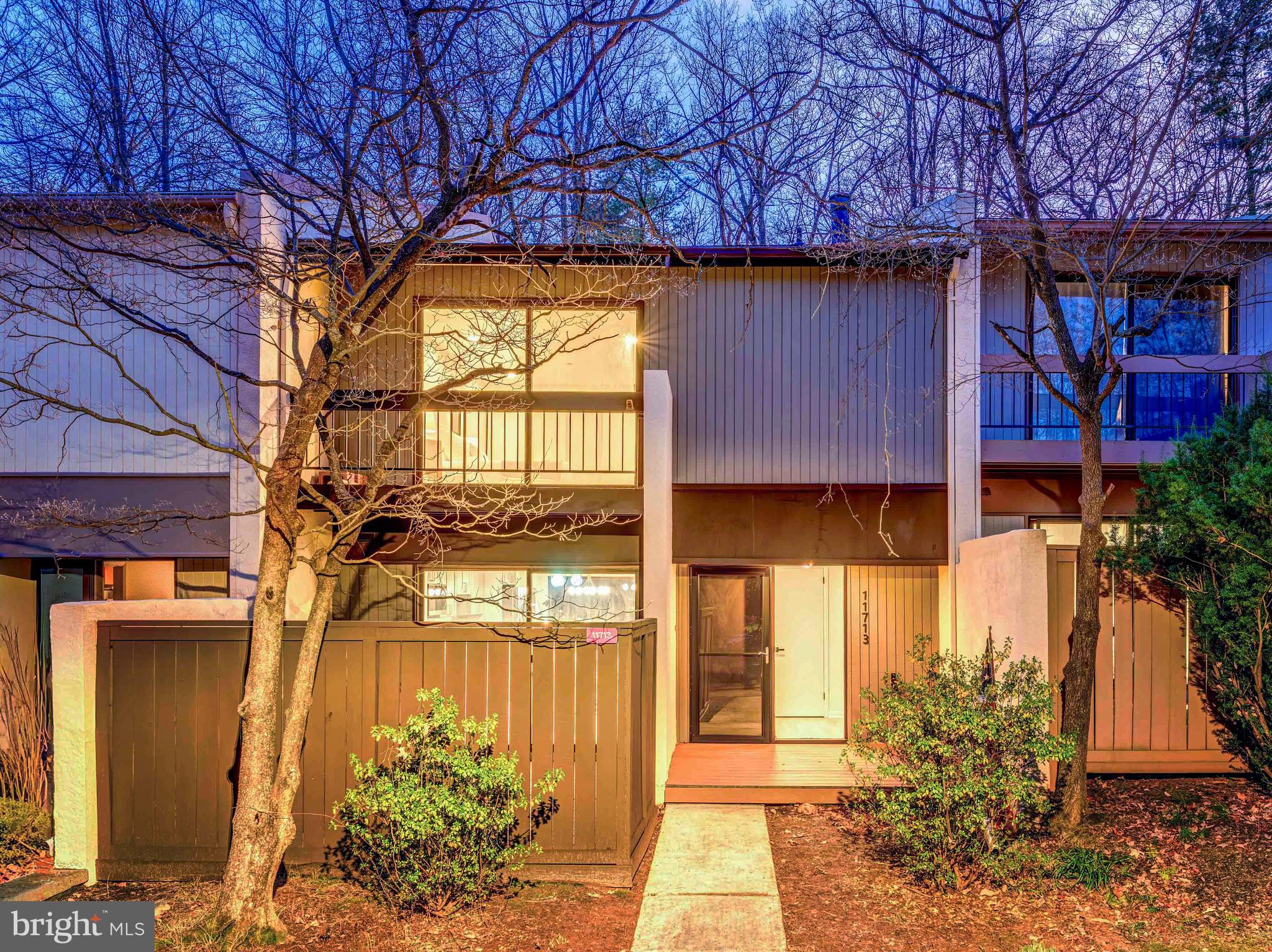 Welcome to Newbridge, a tucked-away Reston community in the South Lakes area where mature trees, quiet streets, dedicated parking, and the pathway lifestyle make everyday living feel a little more elevated, and where this gorgeously renovated 4 bedroom, 3.5 bath home delivers the kind of true move-in-ready finish buyers rarely find. Every inch has been redone with a designer-clean look and smart, functional upgrades, including engineered hardwood throughout, brand new carpet on the stairs, fresh paint from top to bottom, and all new hardware for a crisp, cohesive feel. The main level is the heart of the home, completely reimagined to create an open, airy layout that connects the kitchen, dining, and family room so it lives the way people actually want to live now, perfect for entertaining, holidays, or just a relaxed night at home. The kitchen is the showstopper with brand new stainless steel appliances, quartz countertops with a full quartz backsplash, all new soft-close cabinetry, and a true pantry with pullout storage that keeps everything organized and out of sight. All 3.5 bathrooms have been fully renovated, including the powder room, with new toilets, vanities, flooring, tilework, lighting, updated fixtures, and sleek shower niches that give the home that high-end custom feel, while the primary suite feels like a retreat with a private balcony and a spa-inspired primary bath featuring a dark wood dual vanity, new mirrors and lighting, new flooring, and a beautifully retiled shower with all new fixtures. Recessed lighting and new fixtures throughout keep everything bright and polished, and practical details are handled too with a new washer and dryer and excellent storage, including a lower-level storage room with shelving. With three fully finished levels, the space is flexible and generous, including spacious bedrooms and an expansive rec room that’s ready for movie nights, game days, a gym setup, or a second living space, plus plenty of storage to keep life feeling uncluttered. Outside, the lifestyle gets even better with a brand new deck off the kitchen and a huge, private backyard with a newly installed privacy fence backing to trees, creating a luxe, tree-lined backdrop that feels like your own natural screen. Big-ticket items are already in place, including HVAC and AC replaced about two years ago, a hot water heater about one year old, and a roof approximately 8 to 9 years old. The location ties it all together, minutes to Reston National Golf Course, walkable to the community pool, and close to everything that makes Reston so magnetic, including Reston Town Center, the energy of Reston Station, and the Silver Line at Wiehle-Reston East Metro with dining, shopping, and continued new development reshaping the corridor, giving you the best mix of established neighborhood charm and modern convenience. As part of Reston Association, you also get access to 15 pools, 55 miles of trails, numerous parks, 4 beautiful lakes, 52 tennis courts, 18 pickle ball courts, a variety of community events and programs throughout the year, including festivals, concerts, workshops, and social gatherings, several community centers, including the Reston Association's main headquarters, the Walker Nature Center, and the Lake House at Lake Newport, which offer spaces for community meetings, classes, and special events.