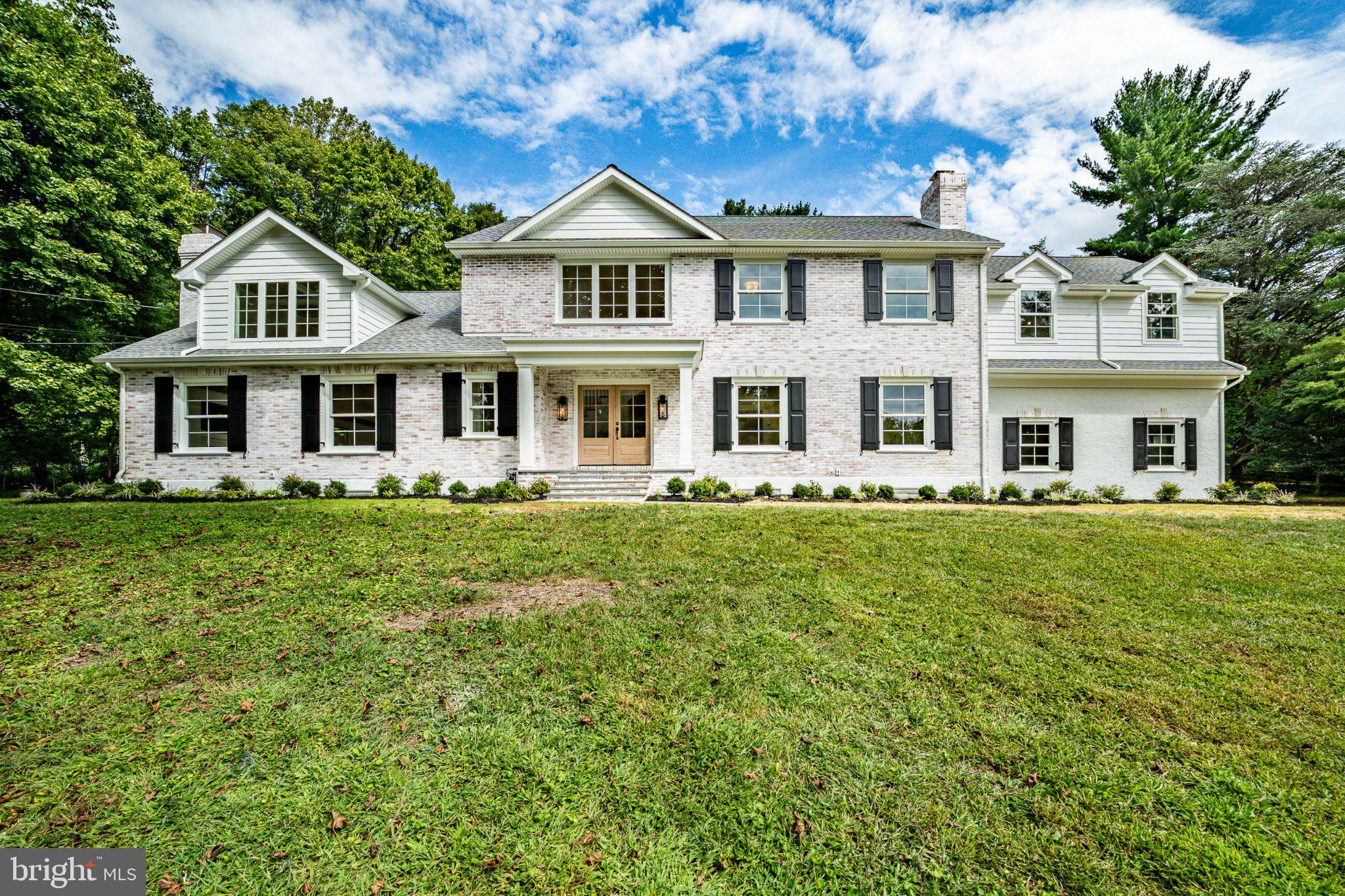 Welcome home to a classic Bryn Mawr beauty that has been completely renovated from top to bottom. Limewashed brick and traditional shutters give this home instant curb appeal and a timeless look. Inside, you'll find more than 5,000 square feet of thoughtfully designed living space, with room to grow.Step into a striking herringbone entryway that opens to wide-plank oak flooring throughout. Detailed millwork and elegant molding run through every room, and three fireplaces add warmth and character to the main living spaces.The kitchen is the heart of the home, finished with Wolf and Sub-Zero appliances and designed for serious cooking and easy entertaining. Nearby, a coffee and wine bar with custom built-ins is ready for slow weekend mornings and evening gatherings alike. A private home office makes working from home a pleasure, and a mudroom with custom built-ins keeps everyday life organized from the moment you walk in.Upstairs, the oversized primary suite is a true retreat, with two walk-in closets and a spa-like bath featuring a deep soaking tub. Four more bedrooms give family and guests plenty of space, and the home offers four full baths and two half baths in total.The finished lower level is filled with natural light, a rare find, and includes its own half bath. It's ideal for a media room, gym, playroom, or guest space.Outside, the large property offers plenty of room to add a pool or an additional garage, so you can make this exceptional home entirely your own.Move-in ready, beautifully finished, and set in one of the Main Line's most sought-after communities, this is the one you've been waiting for. Schedule your private showing today.