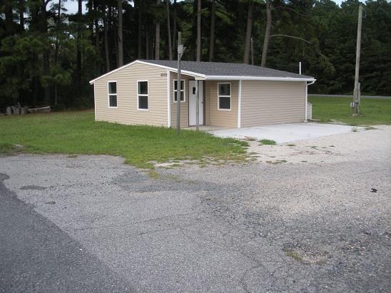 Onley, Rt. 13 Lankford Hwy. Commercial building and 1ac (+/-) of land in the town of Onley where it's a happening place. Has 2 entrances with already constructed driveways--one on Lankford Hwy and one on the town road. Start the business that you have always dreamed of!!!! Let your imagination be your guide. Was used a short time as auto sales.  Acreage, sq ft,age ,measurements & tax info is estimated or taken from county records.