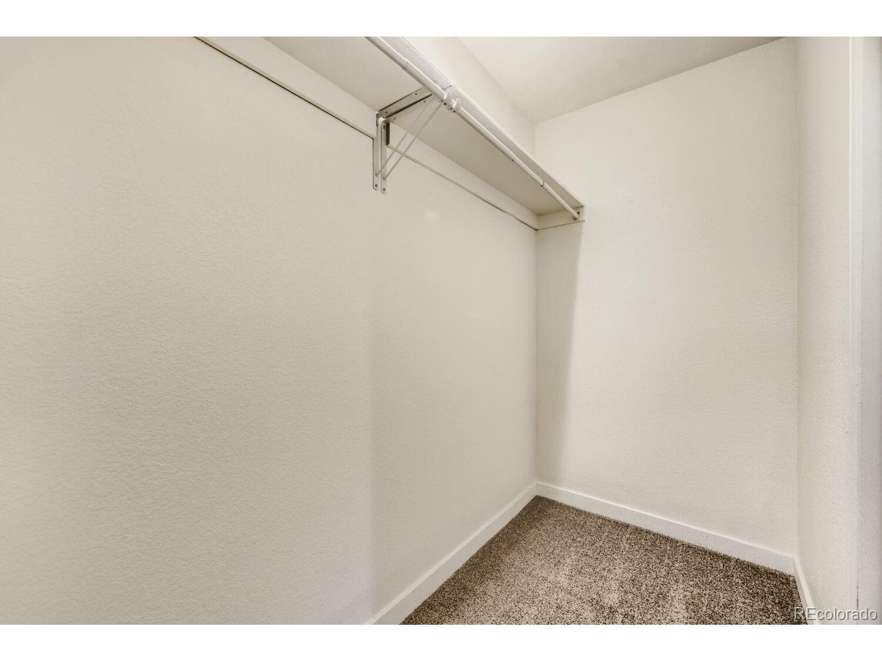 This charming condo is what you have been looking for! It has been tastefully updated and ready for you to move in and enjoy. The kitchen, bath, windows, flooring and paint have all been updated. The kitchen includes granite counters, stainless appliances, tile on floors and backsplash. Bath has newer tile, vanity and mirror. The condo includes 2 bedrooms and one bathroom, patio area out front, a dedicated parking spot in the covered garage below and storage closet outside the unit. Maintenance free living on the exterior and includes a community pool and clubhouse. It is conveniently located in Lakewood near Sloans lake and shops. Easy access to downtown or the mountains!