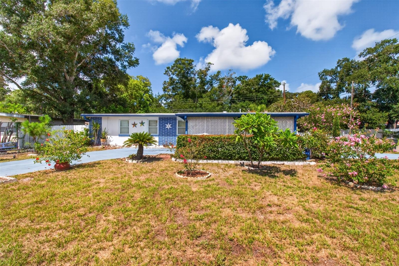 Opportunity Knocks in the Heart of Dunedin! Here's your chance to create something truly special. Situated on a spacious corner lot, this 3-bedroom, 2-bath home offers endless possibilities for those looking to create a home that reflects their own style and vision. Inside, you'll find a comfortable floor plan featuring a family room, dining area, and a kitchen ready for your personal design touches. The primary bathroom has been beautifully remodeled, while the guest bathroom showcases charming vintage character that has been lovingly preserved. A covered, screened porch provides the perfect place to enjoy your morning coffee or relax at the end of the day. Location is everything, and this home delivers! Just minutes from vibrant Downtown Dunedin, you'll love being able to hop on your golf cart and explore locally owned restaurants, breweries, boutique shopping, waterfront parks, festivals, and the Pinellas Trail. With nearby beaches, marinas, and everyday conveniences just around the corner, this is a location that truly embraces the Florida lifestyle. Whether you're dreaming of renovating your forever home or searching for your next investment opportunity, this property offers exceptional potential in one of Tampa Bay's most sought-after communities. Bring your vision and make it your own...the location has already done the hard part!