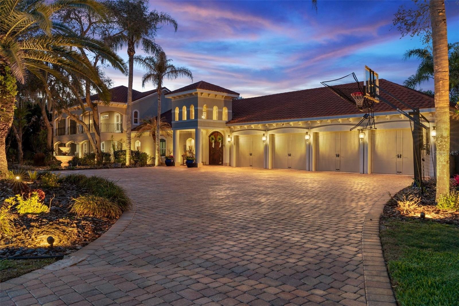 A TRUE MASTERPIECE - This fully upgraded Mediterranean compound spans 5,825 square feet surrounding a STUNNING courtyard built only for the most refined palates -- all privately positioned on a cul-de-sac, with no HOA, on 1.13 acres in one of Port Orange's top-rated school zones.Designed around the most inviting pool oasis, this estate features a versatile layout ideal for multi-generational living and long term guests, with each spacious bedroom offering an en-suite bath. Expansive living areas provide ample space for entertaining at scale and everyday comfort, while the thoughtful upgrades make it an unforgettable statement. Current owners invested significantly in ideal improvements, including:• Remodeled primary bath• Remodeled junior en-suite - Two tankless gas water heaters - Whole-house water filtration system - New Café appliances in the bar & Bosch dishwasher- Mudroom built-in, Closet built-ins, Murphy bed- New pool pumps and wireless pool controls- Exterior LED lighting, with Speakers & VideoThese upgrades provide true turn-key luxury with minimal deferred maintenance. The 4-car garage with oversized attics offer exceptional storage and flexibility. Located minutes from top-rated schools, the Pavilion, the Intracoastal and pristine beaches, this estate combines architectural character with modern mechanical upgrades in a highly sought-after location.Private showings available by appointment only.