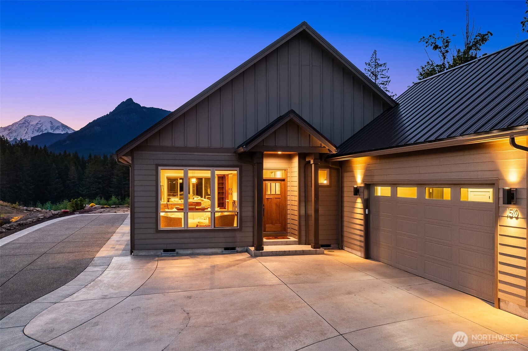 At the peak of Packwood’s premier gated neighborhood is an immaculate open concept, single-level mountain retreat. Look at the pictures; which view do you like the best? The jaw-dropping Mt. Rainier view from the covered patio or sitting by the fire in the cozy family room. Or the ever-changing view from the living room looking West down the Cowlitz River valley with dynamic clouds and light casting across the foothills of the Gifford Pinchot National Forest.    Built in 2022, crafted with acute attention to detail, and pre-inspected to ensure superior quality through-and-through, describing this home as immaculate doesn’t do it justice. The open kitchen offers walls of cabinetry, double ovens, and a separate wine fridge. The primary bedroom features another stunning Mt. Rainier view, a large walk-in closet, and a spa-like bath. The additional two bedrooms share the second full bath and offer beautiful views of the surrounding foothills overlooking the private firepit area.    The manicured hardscape provides ample parking and the oversized two-car garage with Tesla charger offers plenty of space for tuning skis, storing motorcycles, or getting your mountain bikes dialed for a ride up to Packwood Lake.    Moments from the dining, shopping, and breweries in Downtown Packwood, and 25 minutes to both Mt. Rainier National Park and White Pass Ski area, you’ll love coming home to an absolutely perfect property after a long day enjoying the easily accessible world-class recreation.