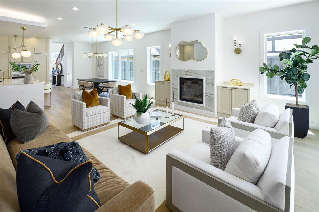 Beautiful inside and curated for sophisticated living! Beautifully designed new construction near the Medical District and steps from West Highland Park and Greenway Parks—offering a level of finish, space and thoughtful design rarely found at this price point. Ideal for buyers working at UT Southwestern or the Medical District, while tree-lined streets, neighborhood walks, shopping and dining make the Highland Park lifestyle just moments from home. Inside, sophisticated designer interiors and a remarkably livable four-bedroom floor plan set this home apart. Custom built by the long-established, family-owned IRACA Group, the home showcases exceptional craftsmanship with Arteriors and Visual Comfort lighting, a striking marble fireplace, marble-framed vanity mirrors and elevated finishes throughout. The open first floor flows beautifully from spacious living and dining areas into a show-stopping kitchen with custom cabinetry, Sub-Zero refrigeration, Wolf appliances and a Bertazzoni range. The patio extends the living space outdoors, while a private first-floor bedroom with en suite bath offers flexibility for guests or a home office. Upstairs, an expansive game room with built-in bar joins a luxurious primary retreat and two additional en suite bedrooms. Upgraded windows, extra insulation, hard-wiring for future automation, generator readiness and a builder warranty add meaningful value. Both 3719 and 3721 are available—purchase one exceptional residence or both for multigenerational living or investment. An uncommon combination of design, quality, location and space at a compelling price point.