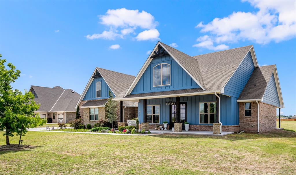Welcome to Brentwood — a highly desired gated addition. It's peaceful and quiet in this neighborhood away from the hustle and bustle of city traffic. Nestled on an extra large and spacious .76 acre lot this home is a showstopper from every angle. It gives you that peaceful out-of-town feel while keeping you close to I-35, OU, Riverwind Casino, shopping and dining options. Calling all classic farmhouse lovers! Start your day on this lovely and peaceful front porch swing. Inside the home, the layout includes 5 bedrooms, 3 full baths + an adorable powder bath with a shiplap accent wall, and an oversized 3-car garage with two entrances. A breathtaking, cathedral-vaulted great room flows across the great room and right into the kitchen, creating the ultimate central gathering space. It features custom barn doors, a floor-to-ceiling shiplap fireplace, and double doors leading to a large covered patio. You will love your new kitchen. It has been designed with a large island, abundant storage, oversized white farmhouse sink, and double ovens! You'll obsess over the true walk-in butler's pantry, complete with a countertop and outlets perfect for hiding your appliances as well as shelving for all of your storage needs. The master suite is an oasis with double vanities, a custom shower, and a deep water freestanding tub that is so relaxing at the end of your day. The massive master closet has been thoughtfully designed with custom shelving, multiple hanging rods, sitting bench, mirror and shoe shelving! Need more? With a house this amazing, even the utility room has upgrades - a long bonus countertop space along and utility sink. You might not hate doing laundry once you move- in. With huge walk-in closets and two flex spaces (perfect as a study and bonus room, or 4th/5th bedrooms), this home is full of upgrades and waiting for its new family. Schedule your showing and welcome home!Call today and ask about builder incentives up to $10,000.