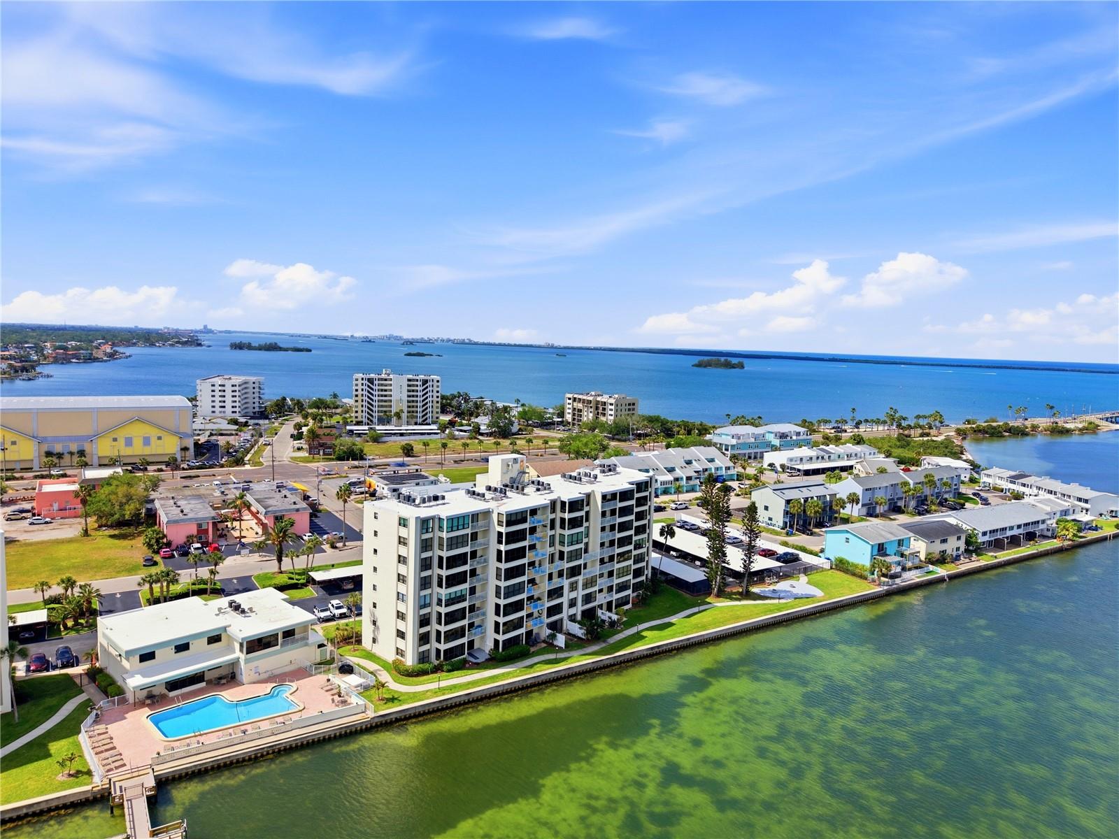 Penthouse living on the water in Dunedin where every detail, every view, and every moment feels elevated in experience.A top-floor waterfront residence at this price point on the Dunedin Causeway is increasingly rare… especially one with this level of view, condition and positioning.Your backdrop is an uninterrupted canvas of shimmering open water and endless sky. This isn’t just a view… it’s a breathing experience. Watch pelicans glide at eye level, kayakers drift by in the distance, and witness nature’s rarest appearances with manatees, stingrays, dolphins, and even the occasional sighting of a rare white dolphin that has been spotted in these waters. No two days are ever the same, and that’s exactly the point.And here, the pace slows the moment you step inside… replaced by water, light, and uninterrupted horizon lines in every direction. And it begins the moment you arrive…Inside, the home has been refreshed with a clean, polished feel, featuring fresh paint throughout, updated lighting, new doors, baseboards, and molding. The kitchen includes newer appliances and fixtures along with a breakfast bar perfectly positioned to take in the water views… turning your mornings into an experience. The main living areas are finished with rigid core luxury vinyl flooring, offering both durability and a refined coastal aesthetic.The layout is both functional and thoughtfully designed. A spacious central living area acts as the heart of the home… beautifully separating the split floor plan… offering privacy for guests while maintaining an open, airy flow ideal for everyday living and effortless entertaining.The primary bedroom has its own ensuite bathroom with a remodeled walk-in shower and seated bench. The second bedroom is located on the opposite side of the condo and features a walk-in closet with private access to the guest bathroom, which also opens to the main entryway for guests… creating a flexible and thoughtful layout for hosting.A discreet built-in laundry closet includes a newer stackable washer and dryer. Additional improvements include added pantry storage and a new electrical panel with surge protection… delivering comfort and true peace of mind.Out of your front door and through the kitchen window, you will see sweeping views of award-winning Honeymoon Island and Caladesi Island, and even the iconic shoreline of Clearwater Beach… a rare perspective that instantly sets this residence apart.A private outside storage closet adds additional convenience, and entrance to Island Towers is secure with a lobby gate code.Beyond the residence, the building continues to evolve with meaningful updates, including a new roof, electrical improvements, and ongoing restoration of the clubhouse. The pool area is complemented by a relaxing sauna… creating a true resort-style setting just steps from your door.And then, the lifestyle.Just minutes from the pristine shores of award-winning Honeymoon Island, the ferry to Caladesi Island, and direct access to the Pinellas Trail. Nearby, the vibrant heart of Downtown Dunedin offers boutique shopping, dining, charming cafés, and a coastal energy that’s both relaxed and refined.This is more than a top-floor unit… it’s a true penthouse sanctuary with a front-row seat to Florida’s most captivating waterfront lifestyle.Imagine the life you could live here… Let’s make it a reality!See… Fall in Love… Make it your own!!