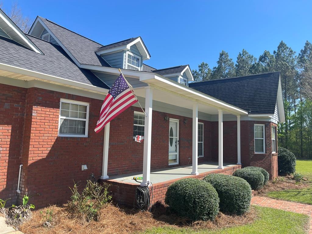Private Country Brick Home with Acreage!  New Interior Paint.  New Carpet in Great Room and Master Bedroom!  This home is ready to go.  Mature Pine Plantings create a living wall of privacy.  Beautiful Yard.  Workshop!  Front Porch! Large Deck for entertaining and grilling!  Spring breezes and summer shade!  Property is zoned R-1 so a division for another home could be possible, (check with county planning and zoning).  You're gonna love this home.  This is a quiet, country dirt road they write and sing songs about. If you love horses, you're going to love the neighbors! Quartz Counter Tops,(Iced White). A wonderful home that checks most of the boxes.  Easy to show. Security.