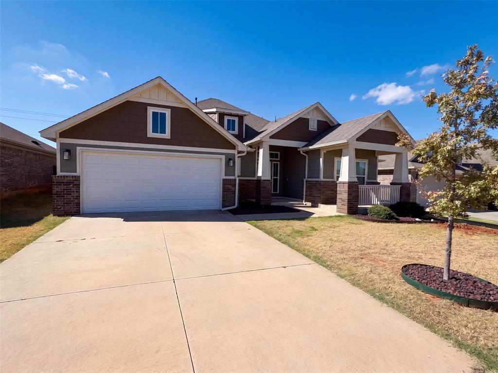 612 Carolyn Ridge Rd is a one-story Norman detached home built in 2019 with an open layout and backyard patio. The kitchen includes dark cabinetry, light counters, stainless steel appliances, a center island, and dining access. The main living area has wood-look flooring, ceiling fans, and natural light from broad windows. Bedrooms include soft flooring and closet storage, while bathrooms include double sinks and tub or shower layouts. A covered entry and 2-car attached garage complete this Oklahoma residence with practical spaces inside and out. Included 100-Day Home Warranty with buyer activation