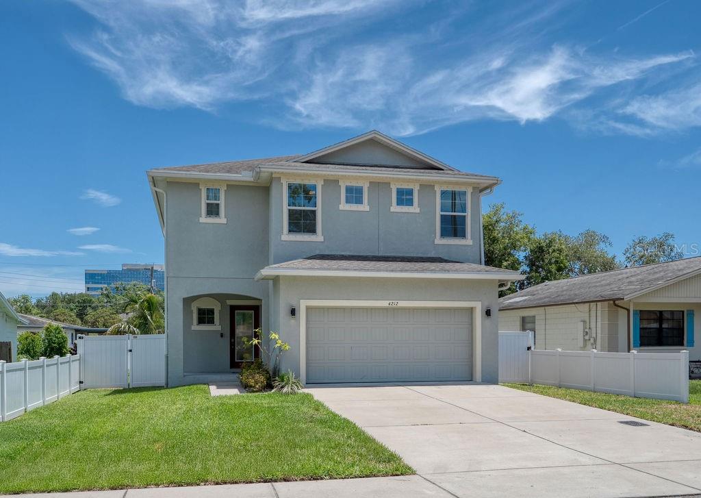 Welcome to the “Elaine” model by Domain Homes, built in 2017 and located in one of Tampa’s most strategic and rapidly growing neighborhoods. Just minutes from International Plaza, Midtown Tampa, the Westshore Business District, and Tampa International Airport, this home offers unbeatable convenience with quick access to I-275 and some of the city’s trendiest restaurants.

This spacious 4-bedroom, 2.5-bath home features an open-concept layout with soaring 9’4” ceilings and stylish **wood-look tile flooring throughout the main level**. The kitchen is a showstopper with solid stone countertops, designer finishes, **pendant lighting**, a large eat-in island, **a huge walk-in pantry with custom adjustable shelving**, and ample cabinet space.

Upstairs, the **laundry room is conveniently located** near all bedrooms. The luxurious primary suite includes a private ensuite bath with dual vanities, solid stone countertops, and fully updated **his-and-her walk-in custom closets**. Every bedroom is equipped with **built-in custom closet systems** for optimal organization.

Other upgrades include Luxury Vinyl Plank flooring upstairs, modern “fandeliers,” updated porch and coach lighting, a screened lanai with fans, and a Ring security system with doorbell and rear camera. The garage includes three overhead storage racks for even more space. Fenced yard with vinyl privacy fence (it is three years old) and Dual zone thermostats for added energy efficiency.
The home also features a **Taexx pest control system**—a network of in-wall tubes that discreetly delivers pest control materials throughout the home.

**No deed restrictions**—so bring your RV or boat! **Not in a flood zone and has never flooded.** Two years of the builder's structural warranty remain on this lovely home.

**Bonus for VA buyers:** The remaining mortgage balance of $265,000 at a 2.25% interest rate is assumable.