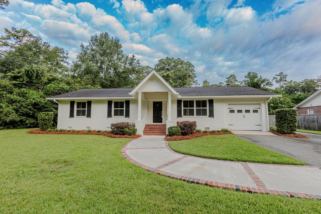 Welcome to 102 Linwood Lane, offering the best of Thomasville living with the peace and privacy of a county setting. Ideally located just minutes from downtown Thomasville, Glen Arven Country Club, and Archbold Hospital, this home combines convenience with quiet surroundings.  Set on a spacious half-acre lot, this 3-bedroom, 2-bath home features a bright, open-concept layout designed for easy living and entertaining. The kitchen flows into the family room, creating a welcoming central gathering space.  Enjoy outdoor living on the covered brick back porch or relax on the charming front porch overlooking a lovely walkway.  102 Linwood Lane delivers the rare balance of city convenience and country tranquility, with shopping, dining, healthcare, and recreation all just minutes away.
