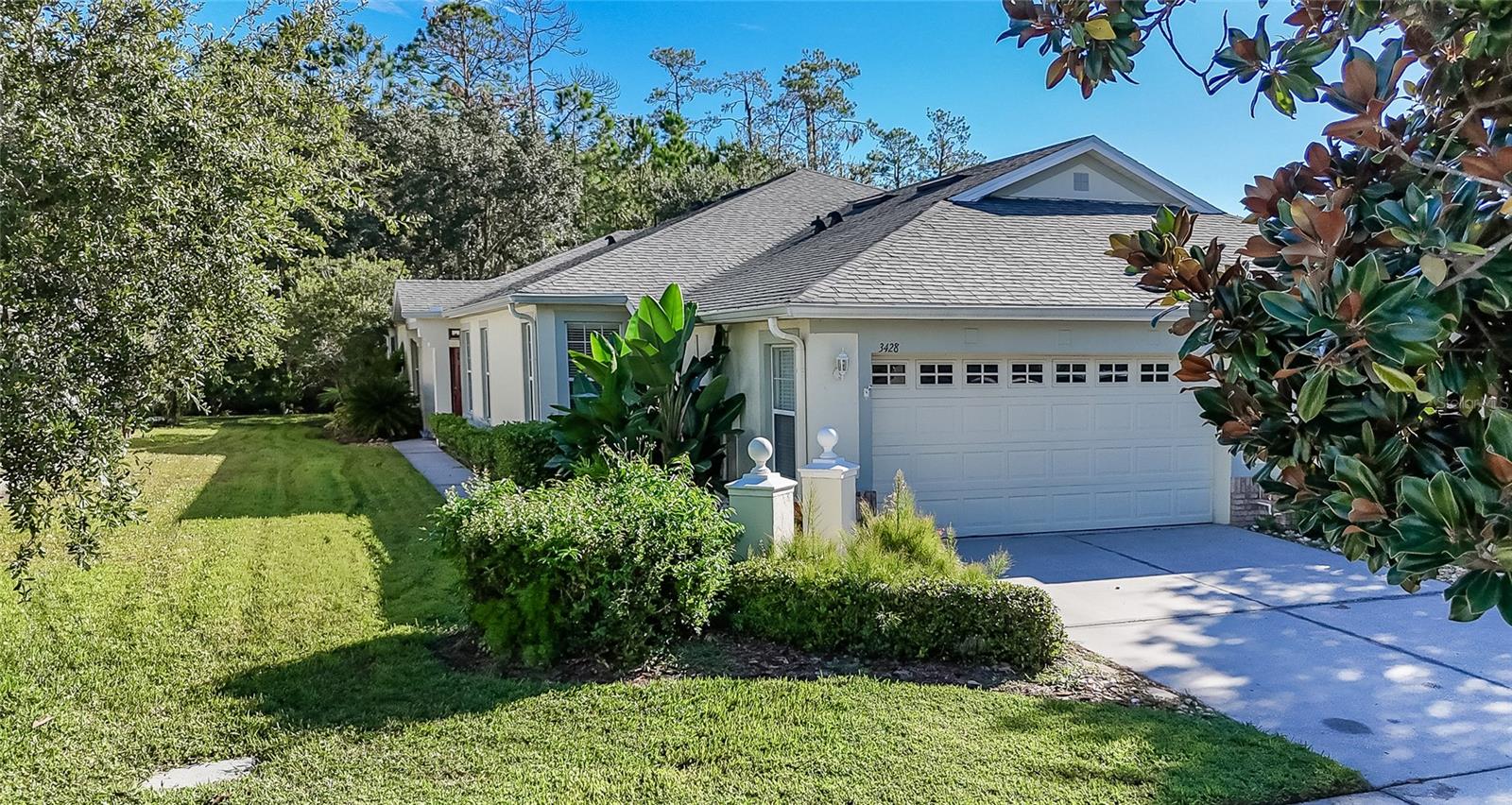 MAINTENANCE-FREE LIVING IN THE HEART OF SEVEN OAKS! Welcome to this beautifully maintained ONE-OWNER VILLA located in the exclusive GATED enclave of WILLOW CREEK, one of the most desirable neighborhoods within Seven Oaks. Enjoy a carefree lifestyle with an HOA that includes ROOF REPLACEMENT, EXTERIOR PAINTING, and LAWN MAINTENANCE, freeing you from costly exterior upkeep and giving you more time to enjoy the exceptional amenities and convenient location that make this community so sought after.This lovingly maintained 3-BEDROOM, 2-BATHROOM villa with a 2-CAR GARAGE features a highly desirable great room floor plan designed for comfortable everyday living and effortless entertaining. Elegant CROWN MOLDING enhances the great room, dining room, dinette, and kitchen, while rich real WOOD FLOORING adds warmth and character to the great room and dining room. The open layout creates an inviting atmosphere filled with natural light and provides the perfect setting for gathering with family and friends.One of the home's most appealing features is its PEACEFUL CONSERVATION SETTING. The oversized EXTENDED LANAI offers a private outdoor retreat where you can relax, entertain, or simply enjoy Florida's beautiful weather. Backing to CONSERVATION, the property enjoys enhanced privacy and a tranquil natural backdrop with no direct rear neighbors. From the CORNER OF LANAI, you'll also enjoy a picturesque POND VIEW, adding another touch of serenity to this already peaceful setting. The combination of conservation and water views creates a calming environment where you can unwind while enjoying the sights and sounds of nature.The impressive 12' x 24' PRIMARY SUITE provides exceptional flexibility, offering plenty of room for a sitting area, home office, reading nook, exercise space, or whatever best suits your lifestyle. The ENSUITE BATH bath features a relaxing garden tub, separate shower, dual-sink vanity, and ample space for daily convenience and comfort. The additional bedrooms are comfortably sized and ideal for family, guests, or hobbies.The home has been thoughtfully equipped with CEILING FANS IN ALL BEDROOMS, the KITCHEN, and the LANAI, and all kitchen appliances, along with the washer and dryer, are included, making this home truly move-in ready.The location simply cannot be beat. Residents enjoy quick access to major roadways, making COMMUTING EASY while placing SHOPPING, DINING, ENTERTAINMENT, and everyday conveniences just minutes away. The Shops at Wiregrass, Tampa Premium Outlets, and an ABUNDANCE of popular RESTAURANTS are all nearby.Willow Creek residents enjoy their OWN PRIVATE COMMUNITY POOL while also having access to the outstanding RESORT-STYLE amenities that have made Seven Oaks one of Wesley Chapel's premier communities. These amenities include MULTIPLE POOLS with a Waterslide, Swim LANES, Splash Centers, Tennis Courts, Pickleball Courts, Basketball Courts, a state-of-the-art Fitness Center, Clubhouse, Playgrounds, and more.This exceptional VILLA offers the perfect combination of MAINTENANCE FREE LIVING, privacy, BEAUTIFUL NATURAL SURROUNDINGS, spacious living areas, and WORLD-CLASS AMENITIES in one of Wesley Chapel's most sought-after communities. Don't miss this opportunity to enjoy the Florida lifestyle you've been dreaming of in the heart of Seven Oaks.