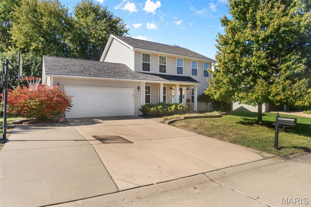 A level, fenced backyard, third-car parking pad, and a quiet interior street set the stage for this four-bedroom, 2.5-bath home in The Highlands! Hardwood floors span most of the main level, with separate living spaces offering flexibility for everyday living, entertaining, or a home office. The kitchen features granite countertops, stainless steel appliances, a center island, pantry, and cabinet pull-outs that keep essentials within easy reach. Gather around the wood-burning fireplace framed by built-in shelving or enjoy the backyard views through the expansive windows. A spacious main-floor laundry/mudroom adds everyday convenience. Upstairs, the primary suite includes a walk-in closet and an updated bath with a double vanity, separate shower, and freestanding soaking tub. Three additional bedrooms and a full hall bath complete the upper level. Outside, the generous lot offers room to spread out, with a deck and patio ready for cookouts and evenings around the fire pit. A two-car attached garage, a roof replaced in 2025 with Gutter Helmet system, and an HVAC system replaced in 2019 round out the features. Within walking distance of Veterans Tribute Park and close to bike trails!
