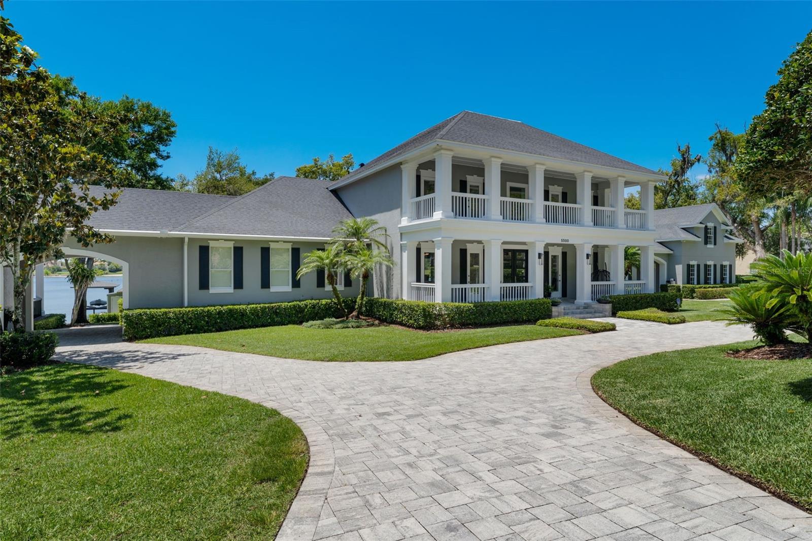 Nestled on a 5-acre lot with 320 feet of lakefront and a private beach on the skiable Lake Davis. This Contemporary 8-bedroom, 6 full bath home wrapped with open porches spans nearly 7000 sq ft. Grand foyer with spiral staircase which features a magnificent glass wine cellar below. Modern, open concept with water views from nearly every room. Master bedroom is located on 1st level along with a separate office. 2nd level features 4 bedrooms and a living room. Separate apartment above the 3-car garage attached by a breezeway. On opposite side of the house, attached by a breezeway, is a 2-bedroom, 1 full bath, living room, and full kitchen guest house with a large porch overlooking the water. Enjoy pool side entertaining complete with an outdoor kitchen and expansive back deck or bring your entertaining to the lake that features more than 1200 sq ft of outdoor living including a full outdoor kitchen/dining/living room area, boat lift and a private beach.