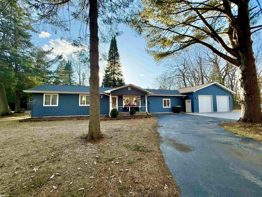 Your "Up North" Dream Awaits! Spacious home on 12 Acres with LAKE ACCESS & incredible storage! Escape to tranquility and adventure! Situated on a quiet street and offers the perfect blend of peaceful living and fun on all-sports Lake St. Helen. Enjoy private neighborhood beach access with a pavilion, creating the ideal setting for summer days. Step inside to discover a remodeled kitchen featuring stunning solid wood Amish-built cabinets. The inviting 4-season room provides versatile space for dining, relaxing, home office, or your favorite hobbies. Recent updates abound, ensuring peace of mind and modern comfort including new roof, insulation, flooring, electrical, 5" well, siding, HWH, furnace, C/A, and more. Car enthusiasts, hobbyists, and those with lots of "toys" will be amazed by the incredible garage space! You'll find a newly finished, attached 4-car garage with extra tall ceilings/doors, & drain in the floor plus an additional 4-car garage with lean-to offering storage for 8 vehicles, boats, RVs, four-wheelers, beach/camping gear, and more! Inside, a huge family/bonus room provides ample space for gatherings and relaxation. Master Bedroom with en-suite bath. Kitchen appliances & dryer included. Embrace the outdoors with plenty of room to roam & enjoy the peace and quiet of nature. Conveniently located 15 minutes from West Branch & Houghton Lake, 1 hour from Gaylord, Cadillac, & East Tawas. Ideal for year-round living, fantastic vacation home, or a lucrative Airbnb income property. Don't miss this unique opportunity to own your piece of Northern Michigan paradise!