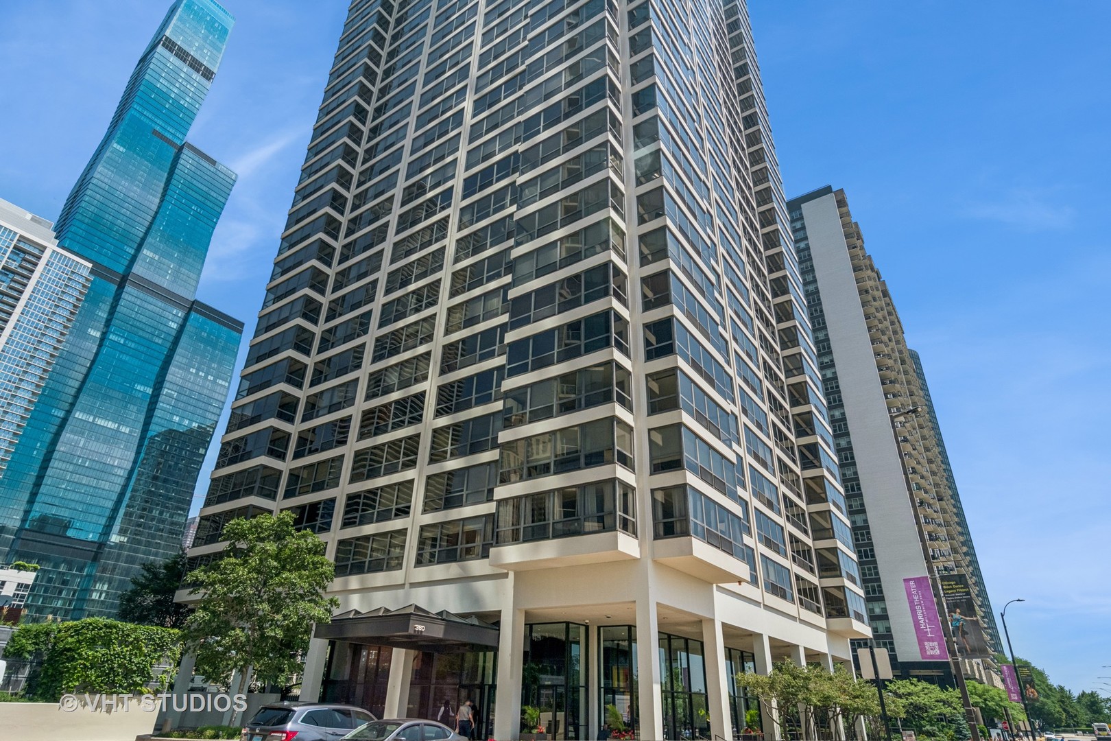 Unbeatable location directly ACROSS FROM MILLENNIUM PARK. This beautifully updated 2 BED, 2 BATH condo offers 1,300 SQFT with SWEEPING CITY VIEWS and incredible NATURAL LIGHT. The EAT-IN KITCHEN features WHITE BROOKHAVEN CABINETRY, GRANITE COUNTERS, and a BRAND NEW REFRIGERATOR. The spacious PRIMARY SUITE includes NEW CARPET and a FULLY RENOVATED BATH with DESIGNER FINISHES, and a MASSIVE WALK-IN CLOSET. GUEST BATH also updated with NEW VANITY and SINK. HARDWOOD FLOORS throughout main living areas, plus IN-UNIT WASHER/DRYER.   FULL-AMENITY BUILDING with TOP-FLOOR INDOOR POOL, SAUNA, SUNDECK, FITNESS ROOM, PARTY ROOM WITH GRILLS, and EXTRA LAUNDRY ROOM. Steps from MARIANO'S, MAGGIE DALEY PARK, DOG PARK, ICE RINK, LAKEFRONT, THE LOOP, and PUBLIC TRANSPORTATION. HEATED GARAGE PARKING (P3-144) INCLUDED.