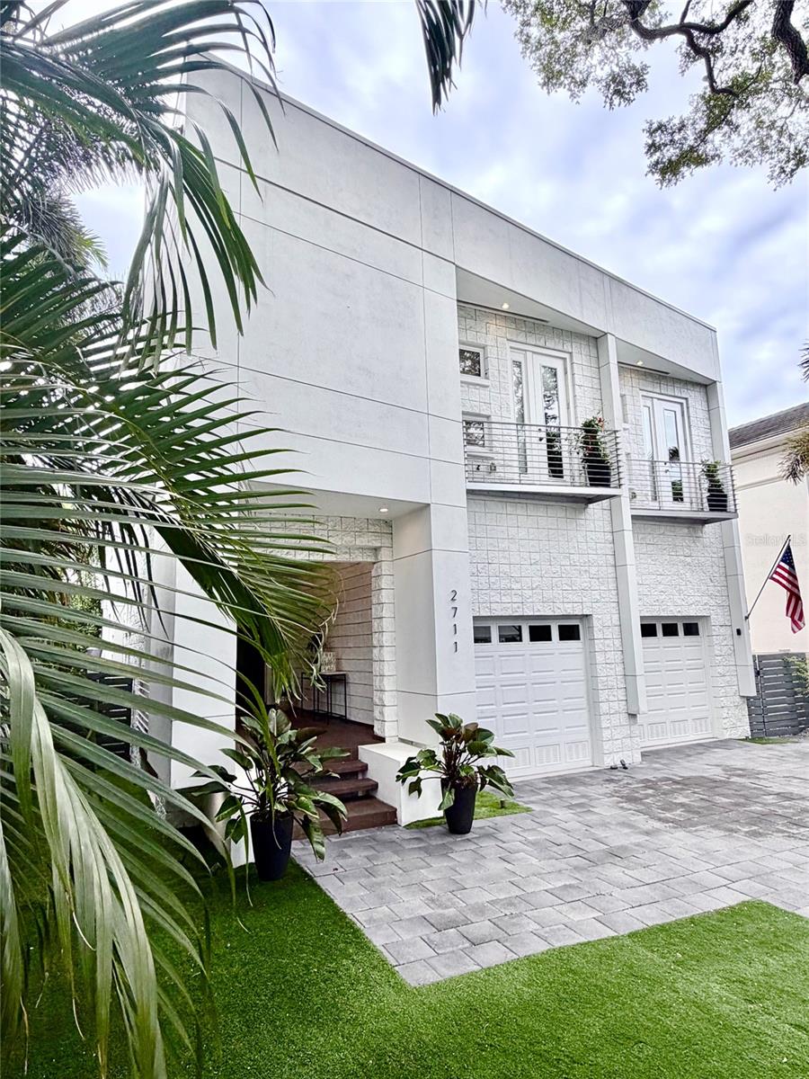 Contemporary South Tampa luxury in the highly sought-after Ballast Point area. Designed for entertaining and everyday living, this home features a dramatic open-concept layout with an oversized chef’s kitchen, massive island, and a 6-panel sliding glass wall opening to the resort-style pool and spa for seamless indoor-outdoor living. Add to that a sub-zero fridge and a wolf range!The flexible floorplan offers ideal space for families, guests, multi-generational living, or a dedicated theater, gym, office, or media room. The primary suite includes a private balcony overlooking the pool and spa.Key features include a 2023 roof, 3 HVAC systems with one brand-new unit (26), 2 others professionally maintained, elevator access, high-clearance garage with lift potential, and possibility of assumable flood insurance under $1,100/year. Built on a higher portion of the street, the home has never flooded.Minutes to Ballast Point Park, Tampa Yacht and Country Club, Hyde Park, Downtown Tampa, and Tampa International Airport. Aggressively priced below recent bank appraisal (Dec '25), this is exceptional value in one of South Tampa’s strongest lifestyle markets.
