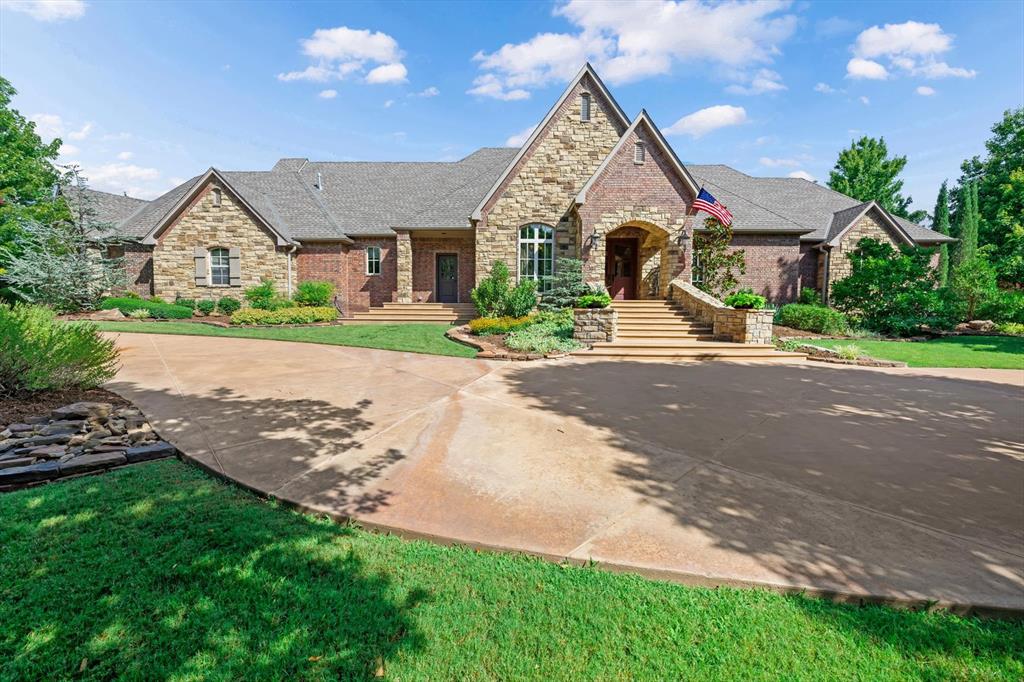 Welcome to exceptional luxury living on a beautifully landscaped one-acre estate, where timeless elegance meets everyday comfort. From the stunning double-door entry to the resort-inspired backyard, every detail of this custom-built home has been thoughtfully designed for gracious living and unforgettable entertaining.   Offering 5 bedrooms, 4 full baths, 2 half baths, a private office, formal dining room, craft room, and an expansive bonus room, this remarkable home combines exceptional craftsmanship with luxurious amenities throughout.The chef's kitchen is the heart of the home, featuring a six-burner gas cooktop with pot filler, double ovens, warming drawer, built-in microwave, island with microwave, breakfast bar, spice cabinet, under-cabinet lighting, butler's pantry, and an enormous walk-in pantry. The breakfast room flows effortlessly into the living and family rooms, where a fireplace and wet bar complete with a wine refrigerator and ice maker create the perfect gathering space. Escape to the private primary suite with direct access to the pergola and pool, dual walk-in closets—including a reinforced safe room/storm shelter—a spa-inspired bath with jetted tub, oversized walk-in shower, dual vanities, and private water closet. Two secondary bedrooms downstairs share a Jack-and-Jill bath, while upstairs offers two additional bedrooms, a spacious bonus room with kitchenette, craft room, and additional baths to accommodate family and guests. Step outside to your own private retreat featuring an expansive covered patio with fireplace and ceiling fans, a picturesque pergola, sparkling pool with waterfall, swim-up entry, built-in spa, lush landscaping, and fenced grounds with additional natural space to enjoy the peaceful surroundings.  An extraordinary blend of luxury, comfort, and timeless design, this exceptional property offers a lifestyle that is truly second to none.