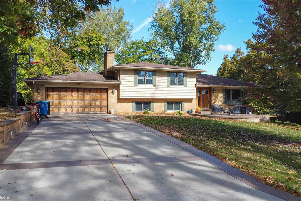 Enjoy lake living with channel access to Crooked Lake in the backyard and beautiful water views from the front. Surrounded by water this location is ideal .This home is expansive -  2,750 finished Sq. ft!!! Water views from every window! Nestled in the desirable Lake Fenton school district. This charming 4-bedroom 3 bathroom home offers the perfect blend of comfort and convenience. Situated on a quiet cul-de-sac, the property features spacious living areas, an updated kitchen, and plenty of natural light throughout. New carpet and fresh paint! Beautiful hardwood floors and ceramic tile. The perfect home to relax or entertain indoors or outside. Enjoy waterfront views from the front porch and your back deck!  Jump on your pontoon and take the channel out to Crooked Lake and enjoy boating, fishing and swimming. Alpine Shores Sub also has a private beach park to enjoy for residents only. This park has a boat launch and sandy beach area, located off of Lake Valley Drive. Conveniently located near downtown Fenton's dining, shopping, and parks. This is lake -area living at its best! Home has a whole house reverse osmosis system. One year home warranty included!