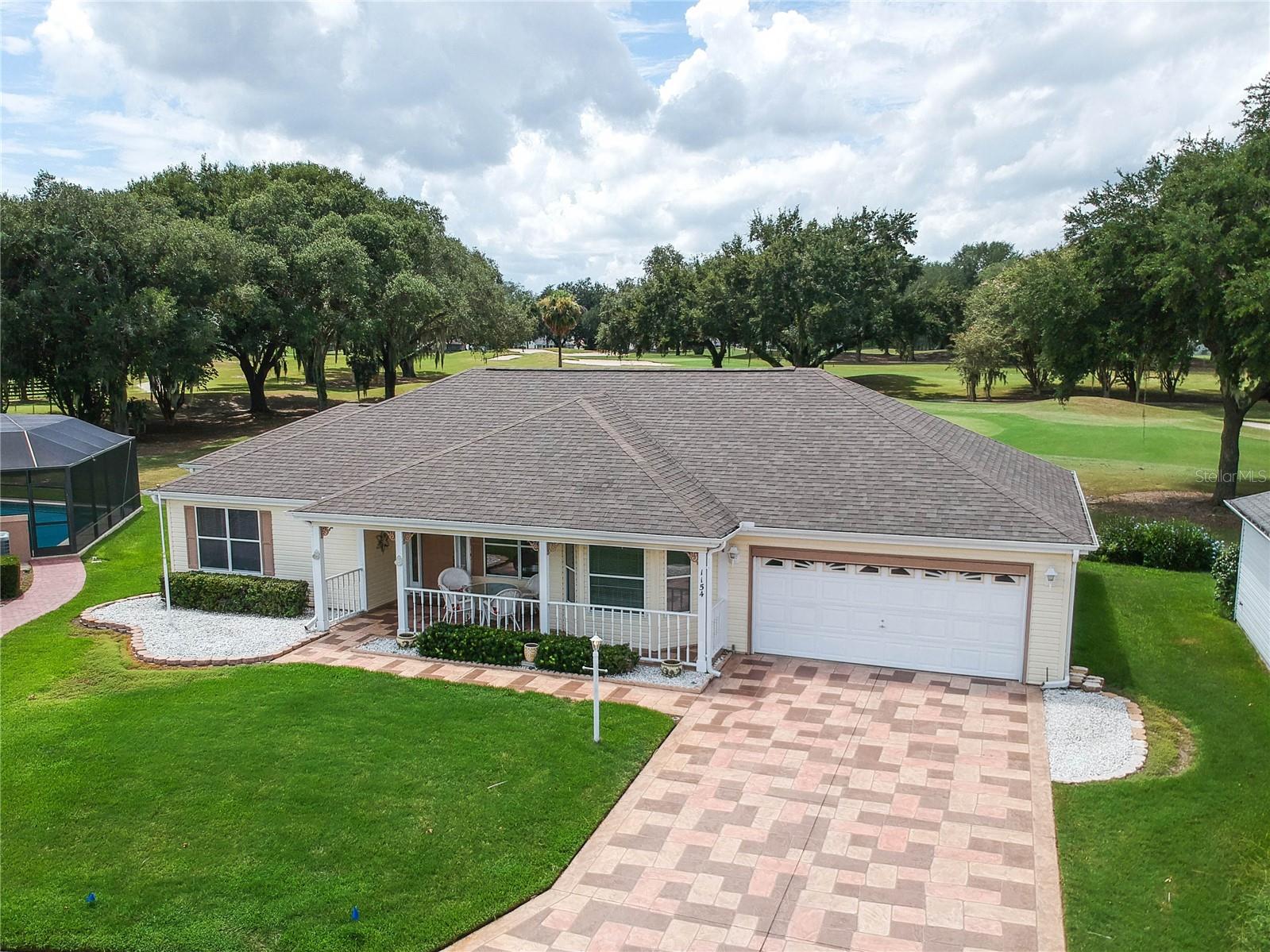 The VIEWS from this 2+ bedroom, 2 bath CUSTOM DESIGNED home are STUNNING!  The home is at the end of a QUIET CUL-DE-SAC in the Village of HACIENDA EAST and there are NO HOMES IN FRONT OR BEHIND.  The sun rises over a WATER VIEW in front and sets over a panoramic UNOBSTRUCTED GOLF VIEW of the Hacienda Oaks Championship golf course in the back.  SPECTACULAR VIEWS can be seen as soon as you step in the front door and from every window on the back of the home. The dining room has a bay window and WATER VIEWS! The kitchen has a breakfast bar, stainless steel appliances, white cabinets with pull-outs and accent lighting. The master bedroom features a tray ceiling, 2 walk-in closets and an ensuite bath with two sinks and a new walk-in shower.  The second bedroom has its own ensuite option with pocket doors and a large closet! The ADDITIONAL 19X14 ROOM is a big bonus and can be used as a den, office or 3RD BEDROOM! There is newer Luxury Vinyl Flooring... No Carpet!   There is also a breakfast nook, a large front porch and a screened in lanai in the back with river rock flooring. The garage has plenty of storage, upgraded lighting, a fan, and a screen door.  The interior of the home has been freshly painted (2025). Home comes Partially FURNISHED and includes a 2007 YAMAHA GAS GOLF CART!  NO BOND!  THIS IS AN AMAZING LOCATION and just a 3 minute golf cart ride to SPANISH SPRINGS Town Square.  Very close to La Hacienda Recreation Center, shopping, restaurants, medical and the many other amenities The Villages has to offer.  Water Heater & ROOF (2019), HVAC (2017).