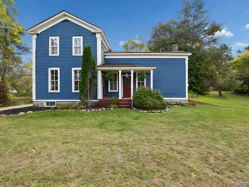 Step back in time to this enchanting historical Johnson Farmhouse, built in 1857 and nestled on 6.5 beautiful acres featuring rolling hills and gentle elevation changes — not just flat land, but a truly picturesque setting. Multiple outbuildings offer endless potential for hobby farming, workshops, or storage — including a 1,500 sq ft multipurpose greenhouse with two garage doors, perfect for gardening, storage, a workshop, or even additional parking. Enjoy the serene pond and lake views across the street, adding to the peaceful and scenic charm of this one-of-a-kind property.This cherished 4-bedroom, 1-bath farmhouse exudes timeless character. Spend quiet mornings on the covered screened-in sunroom, or cozy evenings gathered around the potbelly stove, watching the flames glow and fill the home with warmth. The farmhouse kitchen, centered around its natural wood-burning fireplace, has long been the heart of family gatherings — from all-day holiday cookie bakes with nieces and nephews to memorable meals shared around the table.Inside, original millwork and tall windows fill the home with natural light, showcasing the craftsmanship of a bygone era. While the home does not feature modern updates and awaits restoration, its soul and structure offer a rare opportunity to bring new life to a historic treasure.Step outside and explore the multiple storage barns, the expansive greenhouse, and open acreage ideal for gardens, animals, or future expansion. Whether you dream of a peaceful retreat, a working homestead, or a place to write your next chapter, this property offers the space and serenity to make it your own. ***Property is staged for an Estate Sale - Treasures abound****Air compressor included