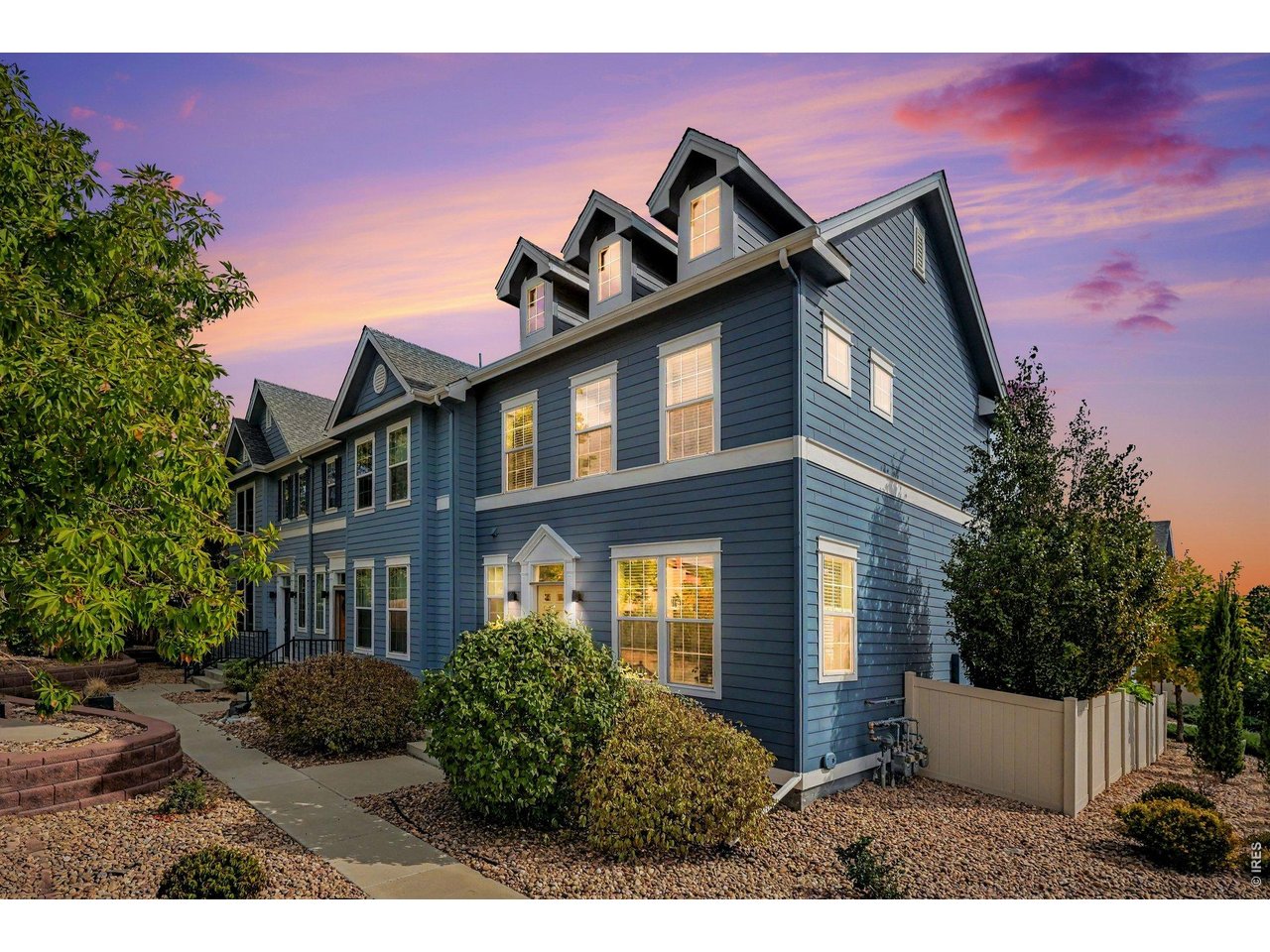END-UNIT TOWNHOME IN COAL CREEK VILLAGE! Enjoy the best of Lafayette living in this 3-bedroom, 3.5-bath townhome built in 2017. Located near Coal Creek Trail, parks, the community pool, and Old Town Lafayette, this end-unit offers abundant natural light, a flexible three-level floor plan, private outdoor space, and exceptional garage storage. The main level features an open-concept kitchen, dining, and living area with hardwood floors, granite countertops, stainless steel appliances, and a convenient powder room. The kitchen opens to the dining and living spaces, creating an easy layout for everyday living and entertaining. A private, fenced backyard and patio extend the living space outdoors. Upstairs, two spacious bedrooms each feature a private en-suite bathroom and walk-in closet. The primary suite includes a 3/4 bath, while the second bedroom's private bath provides flexibility for family, guests, or roommates. A recent A/C upgrade added a return on the upper level to improve cooling and comfort throughout the second floor. The finished basement adds a third bedroom, 3/4 bathroom, and flexible living space-ideal for a guest suite, home office, recreation room, gym, or media area. The detached 2-car garage is a standout feature, offering a deep footprint, impressive ceiling height, and built-in storage racks. There is plenty of room for vehicles, bikes, outdoor equipment, tools, seasonal items, and additional storage without sacrificing parking space. The location puts outdoor recreation close to home, with convenient access to Coal Creek Trail and the surrounding trail network, neighborhood parks, and the community pool. Old Town Lafayette is also nearby for restaurants, coffee shops, shopping, entertainment, and community events. A newer Lafayette townhome with three bedrooms, three-and-a-half baths, a finished basement, private fenced yard, and exceptional garage storage-plus the added privacy of an end-unit.