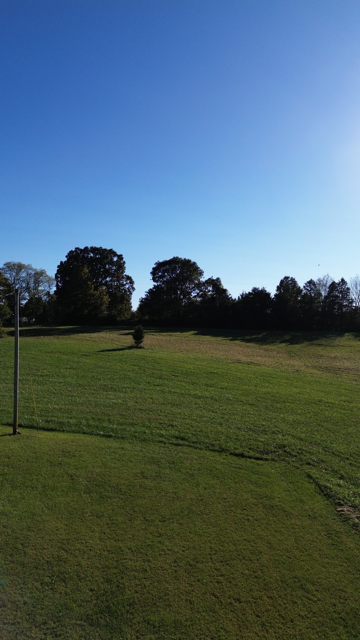 Discover 5 beautiful, rolling acres of unrestricted land, offering endless possibilities. Whether you're looking for a peaceful homestead, an investment opportunity, or a place to build your dream home, this property provides the perfect setting.Currently, the land is utilized for hay production twice a year, making it a great option for agricultural use or passive income. A 2-bedroom, 1-bath mobile home sits on the property, though it is not affixed, providing immediate living space or rental potential.Enjoy the freedom of unrestricted land—bring your horses, start a hobby farm, or create a private retreat. With its scenic surroundings and open space, this property offers both tranquility and opportunity. Conveniently located 3 miles from Center Hill Lake and the full service marina Pates Ford Marina.Don't miss this chance to own versatile acreage in a prime location—schedule your showing todayShown by appointment only.