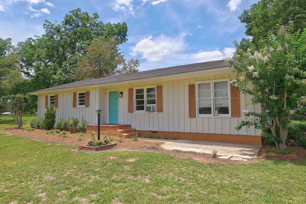 Discover the charm of rural living in this inviting 3-bedroom, 1-bath home offering 1,286 sq ft of character and comfort just outside of Boston, GA. Set on .55 acres and surrounded by wide-open farmland, this property delivers the peaceful country atmosphere buyers love while keeping you only a short drive from Thomasville.  Inside, you'll find original hardwood floors, a cozy layout, and timeless details that make the home feel warm and welcoming. Outdoors, a spacious workshop provides the perfect space for hobbies, storage, or projects, with plenty of room to spread out and enjoy the quiet landscape.  If you're looking for a charming rural retreat with convenience, space, and classic appeal, this property is the perfect fit.