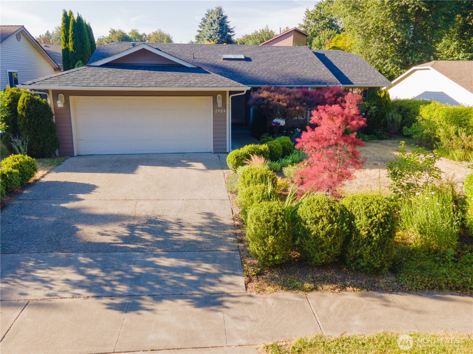 Back on Market! Move-in ready 3 bed, 1.75 bath rambler in Olympia offering 1,720 sqft on a 6,970 sqft lot with attached 2-car garage plus additional driveway parking. Thoughtfully updated with new kitchen counters, sink, and range, fresh interior paint, and new flooring including LVP in main living area, entry, utility, and both bath rooms. New wall-to-wall carpet in bedrooms. Comfortable single-level layout with vaulted ceilings, skylights in the kitchen and living room, provides abundant natural light. Spacious living area features a bay window that enhances the open, inviting feel. Primary suite includes a walk-in closet and private bath for added convenience. Kitchen offers an efficient design with pantry storage, eating bar, and open flow into dining and living spaces—ideal for everyday living and entertaining. Fully fenced backyard with mature landscaping including a variety of fruit trees, deck off the kitchen eating area, and space suited for gardening, play, or relaxing outdoors. No HOA provides flexibility. Located in Olympia School District with McKenny Elementary, Washington Middle, and Olympia High School. Easy access to I-5, downtown Olympia, shopping, and approximately 20 minutes to Joint Base Lewis-McChord. Quiet loop street with central green space offers a peaceful, established neighborhood setting. Welcome Home!