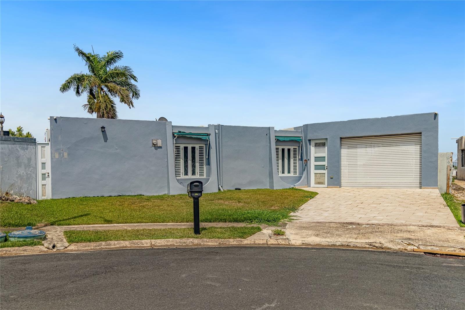 Exceptional opportunity in the highly sought Dorado del Mar community. This property sits on an elevated lot at the private end of a cul-de-sac, offering added privacy and a premium homesite. The outdoor patio provides a partial ocean view, creating a relaxing coastal backdrop ideal for entertaining or enjoying the breeze.Dorado del Mar is a community featuring controlled access, well-maintained roads, and a convenient location near Dorado’s beaches, shopping, dining, and resort amenities. Residents enjoy access to golf courses, tennis courts, walking paths, and recreational areas throughout the community. The community also includes Dorado Academy, a well-known school located within Dorado del Mar, offering added convenience.A rare combination of location, elevation, privacy, and coastal views perfect for your next home or investment in Dorado.