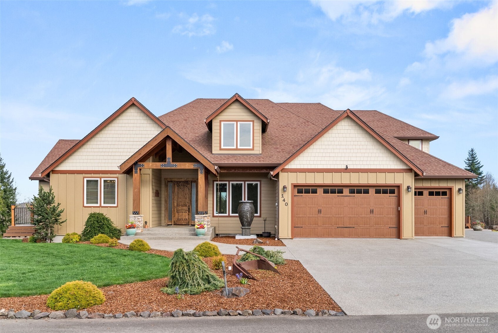 Set across 4.2+/- acres, this 4,015+/- sq ft residence captures a sense of space, light, and quiet that’s increasingly hard to find. Territorial views stretch outward, with partial mountain views beyond, while each morning begins with a truly breathtaking sunrise—best experienced from the home’s expansive wraparound deck. Inside, the materials speak for themselves. Hickory floors, a chiseled travertine entry, and knotty alder trim create a natural, grounded palette that carries throughout. The chef's kitchen is designed for both presence and performance—granite surfaces, a gas range with pot filler, double ovens, and soft under-cabinet lighting that shifts the space effortlessly into evening. Twelve-foot doors open wide to over 1,100+/- sq ft of covered, wraparound composite decking, blurring the line between indoors and out. The layout offers both scale and flexibility, with 3 bedrooms and 3 bathrooms, along with a bonus room, office, and dedicated workout space. The primary suite is set apart as a place to unwind, featuring a soaking tub, dual-head walk-in shower, and a spacious walk-in closet with built-ins. Beyond the home, a 3-car garage is complemented by a fully insulated 36x50 shop with oversized doors, while a second shop—over 1,700+/- sq ft with utilities stubbed—opens the door to future possibilities, whether for extended living, workspace, or something more.