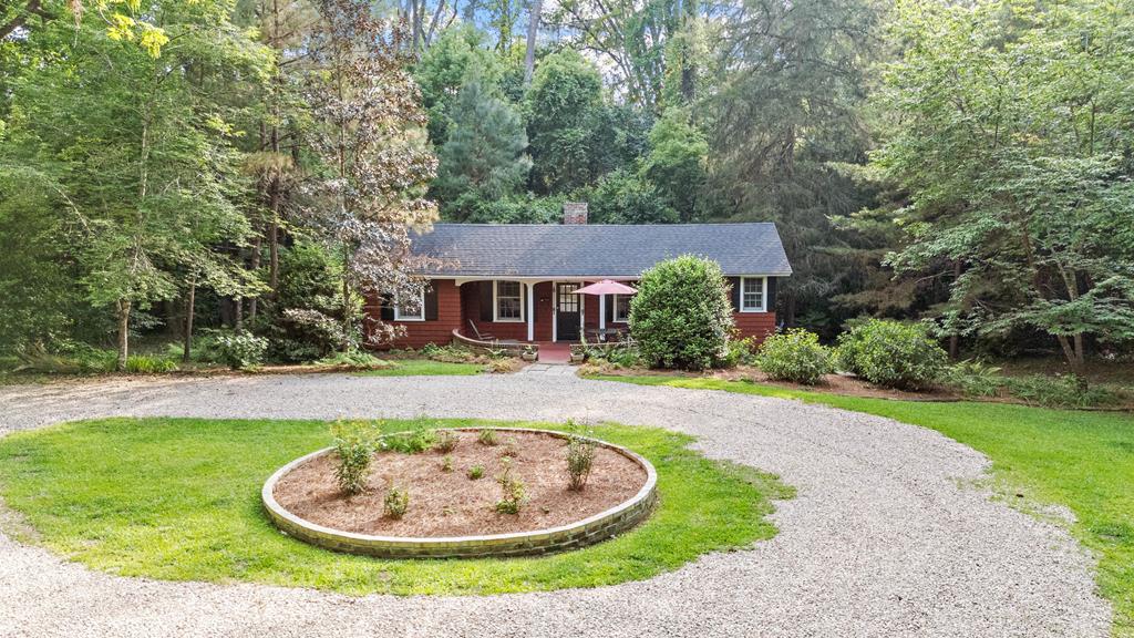 A Rare Opportunity in the Heart of Thomasville Tucked away within the city limits, this remarkable 5.83-acre property offers both privacy and potential — a true legacy estate rarely found in town. At its heart is a beautifully preserved 1930s cottage, full of charm and character. Inside, you'll find a spacious living room with a cozy fireplace, a private bedroom and bath, full kitchen with dining area, laundry, and more — all thoughtfully laid out for comfortable living.  Step outside and be greeted by mature trees, lush plantings, and natural wildlife — a peaceful retreat just minutes from everything Thomasville has to offer. Whether you're looking to enjoy the property as a private residence, explore development possibilities, or simply invest in a unique piece of local history, this is a one-of-a-kind opportunity you don't want to miss.