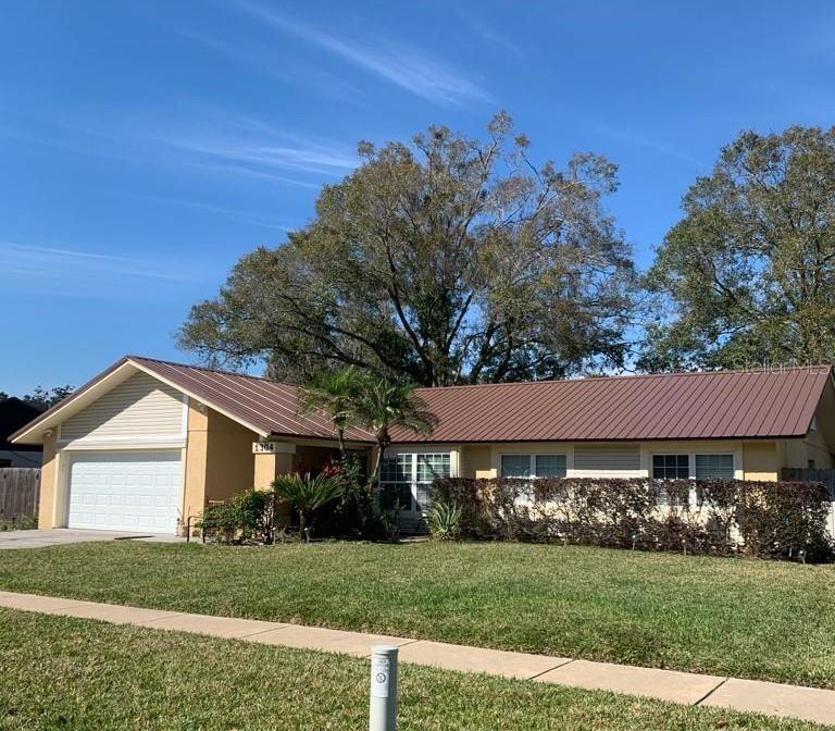 Welcome to Walden Lake! This beautifully maintained 3-bedroom, 2-bath home offers a desirable split-bedroom floor plan and numerous updates throughout. Features include an updated kitchen, updated bathrooms, updated lighting, ceiling fans, tile flooring throughout, and multiple French doors that fill the home with natural light. The enclosed Florida room provides valuable additional living space perfect for relaxing, working, or entertaining. Step outside to a fully fenced backyard complete with landscape lighting, a corner deck for grilling and a gazebo for enjoying Florida’s beautiful weather. Major updates include a METAL roof installed in November 2023 and A/C replaced in August 2021. Residents enjoy access to community amenities including a pool, clubhouse, playground, tennis courts, and basketball courts for a low annual HOA fee of $275. Conveniently located near shopping, dining, schools, and major commuter routes, this move-in ready home offers the best of Walden Lake living.