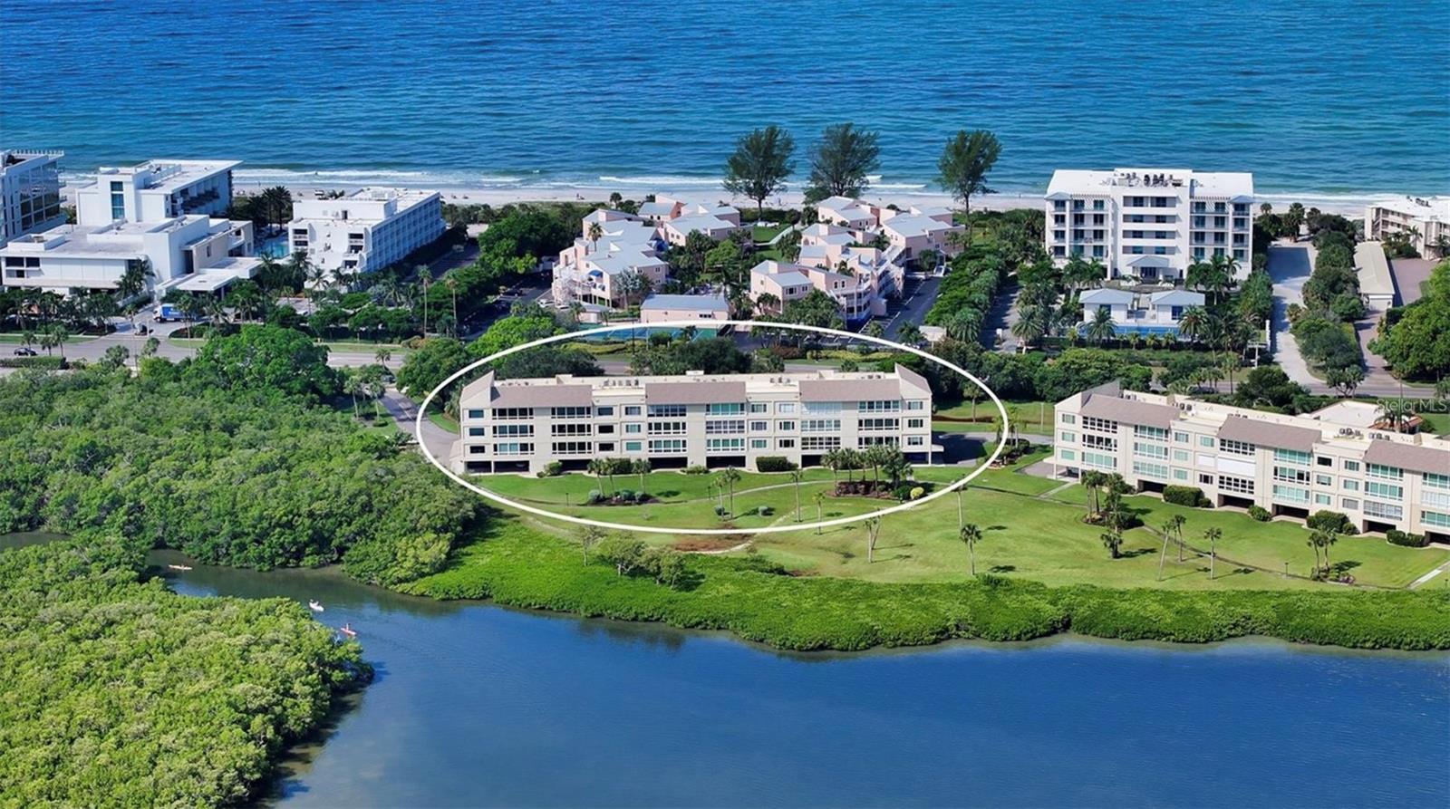 Experience elevated Longboat Key bayfront living in this BEAUTIFULLY UPDATED and impeccably maintained 2-bedroom, 2-bath corner END-UNIT condo. This ELEGANT RESIDENCE offers stunning unobstructed full SARASOTA BAY VIEWS from every room through dramatic FLOOR TO CEILING WINDOWS. EXCEPTIONALLY PRIVATE and boasting the LARGEST FLOOR PLAN in the community, this condo is located on the elevated second floor with convenient elevator access—perfectly blending comfort, sophistication, and coastal serenity. Inside, PORCELAIN TILE FLOORING THROUGHOUT creates a clean, modern aesthetic ideal for low-maintenance Florida living. The lovely updated open-concept kitchen flows seamlessly into the spacious great room, framing tranquil bay views. Features include high end quartz countertops, stainless steel appliances, a large breakfast island, 42” cabinetry, and elegant iridescent Mother-of-Pearl backsplash, with views overlooking the pool and waterfront. The bayfront primary suite is a peaceful retreat with direct lanai access, a generous walk-in closet, and a luxurious ensuite bath featuring a custom walk-in shower, dual-sink vanity, and quartz counters. The second bedroom—also with bay views and lanai access—offers a spacious closet concealed behind a sleek barn door and sits adjacent to the beautifully updated guest bath, making it ideal for guests or a stylish home office. Recent upgrades provide peace of mind, including PGT hurricane-impact windows, including a panoramic window in the great room, a 2021 HVAC system, and a 2020 water heater. Additional conveniences include an in-unit laundry, private storage, and assigned under-building parking. The monthly HOA fee of $1,325 covers hazard, hurricane, and flood insurance, recreational amenities, and FULLY FUNDED RESERVES—a major value for bayfront condo ownership. Special Assessments: Two modest monthly assessments totaling $527. The first assessment is $293 and the second assessment is $234.Located within the sought-after Windward Bay, residents enjoy a true Gulf-to-Bay lifestyle across 26 acres of lushly landscaped waterfront spanning nearly half a mile of Sarasota Bay frontage. Community amenities include BOAT SLIPS ($60/month), kayak storage and launches, three private beach accesses, two heated pools (one just steps away), a fitness center, saunas, tennis and pickleball courts, walking paths, BBQ grills, fire pits, and a clubhouse with library and catering kitchen. With only 151 residences, Windward Bay offers low-density, resort-style living at its finest. The community is PET-FRIENDLY allowing two pets up to 75 lbs each, with green spaces and pet comfort stations throughout. A rare bonus: approved renter pets are also permitted, making this condo especially appealing for investment or seasonal rental income. Ideally located mid-island, you’re minutes from championship golf, full-service marinas, and the dining, shopping, and cultural attractions of St. Armands Circle, downtown Sarasota, and Anna Maria Island. Whether you’re seeking a luxury Longboat Key waterfront condo, a serene island retreat, or a strong rental opportunity, this exceptional bayfront residence delivers the ultimate coastal lifestyle—sunsets included.