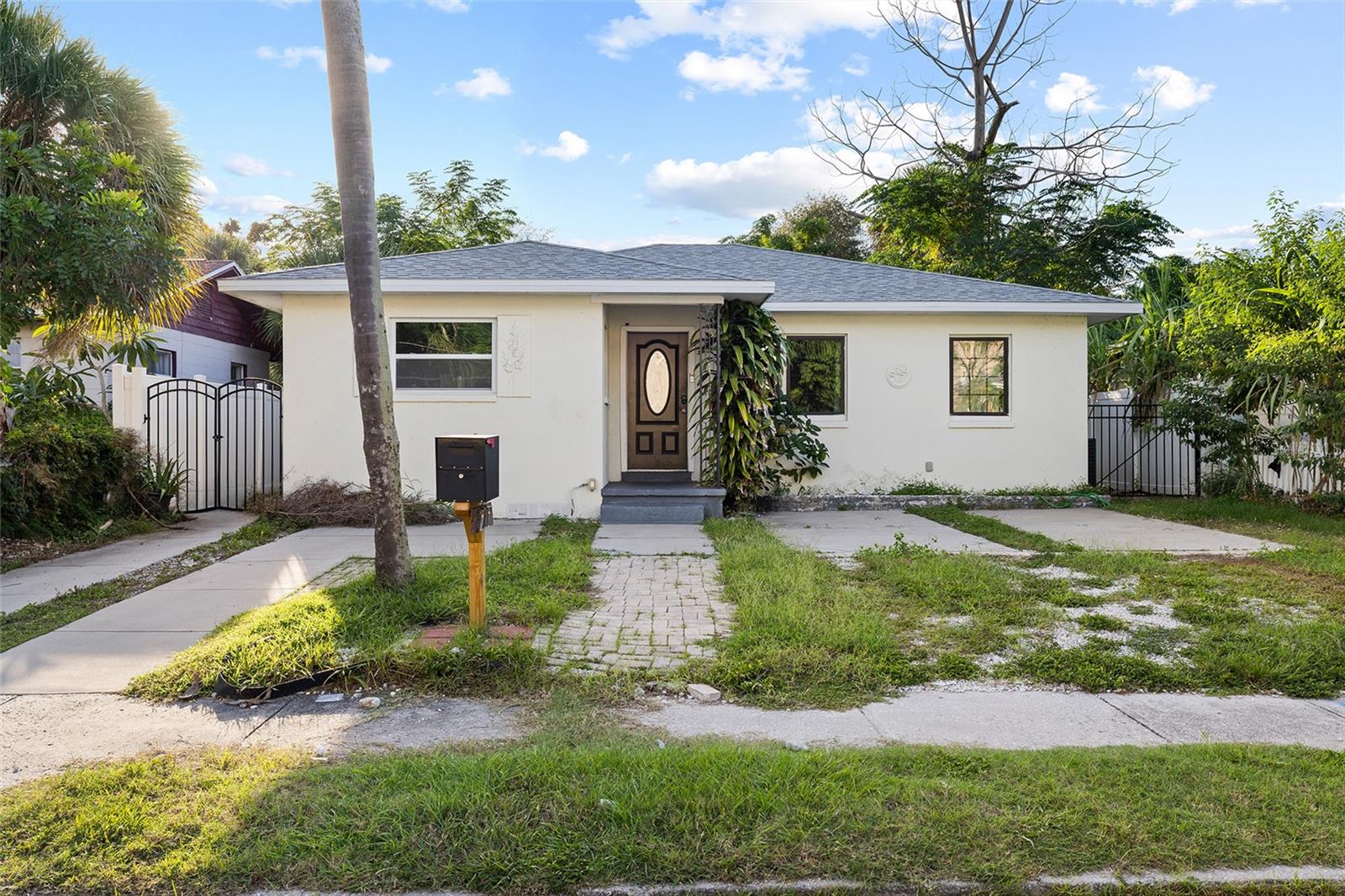 Spacious and versatile property located just minutes from vibrant Downtown St. Petersburg! Whether you’re searching for your next primary residence or an income-producing investment property, this home offers incredible flexibility and potential. Featuring several major upgrades, including a new roof and AC system installed in 2023, wind-resistant windows, and a newly added sixth bedroom, this property offers added value and peace of mind. There is also the convenience of a separate entrance to one of the bedrooms. Inside, you’ll find a bright, inviting living space, updated flooring, a spacious kitchen with granite countertops, stainless steel appliances, and plenty of room to accommodate family, guests, or tenants. Investors, take note! With six bedrooms, this property presents an excellent opportunity for a variety of rental strategies. Consider renting individual rooms to maximize potential rental income or securing a long-term tenant with a traditional annual lease. The flexible layout and convenient location make this an attractive option for investors looking to expand their portfolio, subject to applicable rental regulations. Location is another major highlight! Enjoy easy access to Downtown St. Petersburg. You’re also just a short drive from the beautiful Gulf beaches, Tropicana Field, the St. Pete Pier, and the Grand Central District. Convenient access to I-275 makes commuting to Tampa, Tampa International Airport, and St. Pete-Clearwater International Airport a breeze.