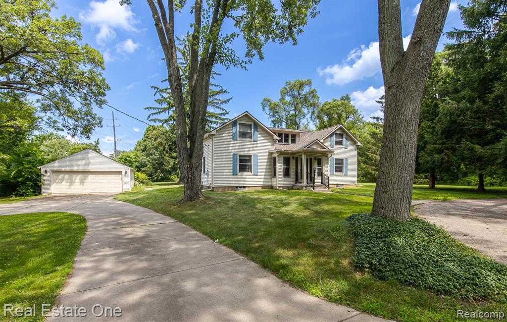 RARE FIND in ROCHESTER – 3.8 Private Acres! You just don’t come across properties like this in the City of Rochester! Have you dreamt of building your own custom home on a gorgeous wooded lot - then this is the property for you. You can tear down existing home and rebuild or enjoy and enhance the current home. Tucked away on nearly four beautiful treed acres, this 4 bedroom, 2 bath home gives you the space you need and the land to explore, while still being close to downtown.  Entry into home is it's own all season sitting room so you can enjoy the view out front. The layout is flexible with 2 bedrooms on the main floor and 2 upstairs – pick your own primary bedroom as they are all a good size! The spacious living room features a beautiful coffered ceiling, wall of windows and wood floors, creating a truly warm and welcoming space. The inviting kitchen features an oversized breakfast nook that overlooks your expansive backyard – perfect to enjoy your morning coffee while watching the wildlife. Upstairs, there’s a flex room that works great as an office, craft room, reading retreat or whatever you like. Step out onto the 2nd floor balcony and take in your bird’s -eye view of the property – it’s peaceful, private and perfect for star gazing - balcony was updated in 2018 with new flooring and railings. New roof 2018, HWH 2025, MANY updates done over the years.  Almost all floors in home are hardwood. Explore Downtown Rochester via a 15 minute walk or head out on the nearby Paint Creek and Clinton River Trails on your bike. If you crave privacy and land in the city, then act now so you can make this rare property yours!