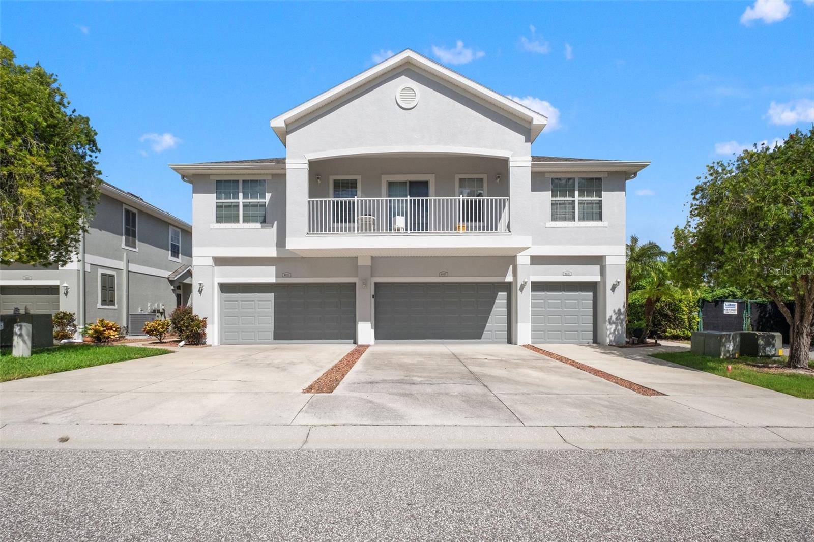 Welcome to 8423 Blue Rock Drive, a beautifully maintained 3-bedroom, 2.5-bathroom townhome with a 2-car garage, located in the desirable gated Little Ridge community of New Port Richey! Offering approximately 1,662 square feet of comfortable living space, this home features numerous recent updates and has been meticulously cared for, making it truly move-in ready. Step inside to discover a spacious and inviting floor plan featuring brand-new luxury vinyl plank flooring throughout the entire home, along with fresh interior paint that creates a bright and welcoming atmosphere. The generous living room provides plenty of space for relaxing or entertaining, while the separate dining room offers a dedicated space for family meals, gatherings, and special occasions. The functional kitchen provides a convenient layout with easy access to the dining and living areas. Just off the main living space, enjoy the double lanai, the perfect place to unwind with your morning coffee, enjoy the Florida breeze, or relax after a long day. Upstairs, you'll find all three generously sized bedrooms, including the spacious primary suite featuring a private ensuite bathroom with a beautifully updated walk-in shower. Additional major improvements include a NEW ROOF, NEW A/C, and fresh exterior paint, providing added peace of mind for the next homeowner. The attached 2-car garage offers convenient parking and additional storage space. Enjoy the benefits of living in the gated Little Ridge community with low HOA fees, offering a convenient, low-maintenance lifestyle without sacrificing comfort or space. Ideally located near shopping, dining, medical facilities, parks, and the beautiful Gulf Coast beaches, this home offers the perfect combination of modern updates, functionality, and convenience. Don't miss your opportunity to make this beautifully maintained property your next home!