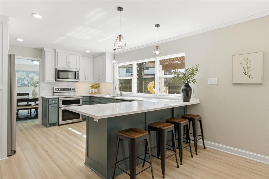 BEAUTIFULLY UPDATED AND TRULY MOVE-IN READY, this home stands out with over $125K in recent improvements! With a show stopper backyard, this home is hard to beat. The backyard is a true highlight. Featuring a newly refinished pool with waterfall, fully fenced for added safety, a large covered patio, dedicated play area, and storage shed. An extra wide gate and RV hookup make it easy to accommodate boats, trailers, or additional outdoor equipment - something rarely found at this price point. Bright and light throughout with abundant natural light and expansive views of the backyard. The fully remodeled kitchen is a standout and open to the living room which features built-in bookcases and a brick fireplace. All bedrooms are generously sized with hard surface floors throughout the upstairs. Additional updates include renovated primary and secondary bathrooms, updated flooring downstairs, and interior and exterior paint. Located in a highly desirable neighborhood with easy access to excellent schools and just minutes from parks, miles of hike and bike trails, a frisbee golf course, and scenic wooded paths. Enjoy close proximity to Lake Lewisville, Lake Grapevine, and a quick 15 minute drive to DFW airport, along with convenient access to shopping, dining, and local community events. This is truly a well updated home in a prime location with a backyard of your dreams!