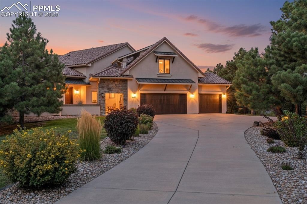 Spectacular Custom home w/ unobstructed views of Pikes Peak and Front Range. Rare location near Voyager & Interquest w/ aprivate country feel. Gorgeous curb appeal w/ stucco & stone, wood beams, iron gate, concrete tile roof, and front courtyard w/fireplace. Open floor plan w/ soaring ceilings, oversized tile flooring, incredible mtn views, formal dining, sun room, loads ofnatural light, executive office w/ built ins, & gas fireplace. Gourmet kitchen features high level granite counters, solid aldercabinets w/ hardware, designer tile backsplash, Bosch appliances, built in butcher block cutting board, 2nd prep sink w/disposal, trimmed out imperial range hood, & Viking gas range. Master suite features Karastan Luxury Kashmere nylon carpetwith ½ inch 8-lb moisture barrier padding & mtn views. Attached 5 piece bath w/ hydromassage tub, spa walk in shower w/rain head, tile flooring, separate sinks, and large walk in closet with his/her sides. Staircase w/ wrought iron spindles andcustom trim work. Upper level boasts large open loft open to main level & an amazing bunk room w/ balcony. Every bedroomhas an attached bathroom except for basement! Large walk out basement features wet bar, newer lvp flooring, & more mtn views!Backyard is perfect for entertaining w/ large multi-level stamped concrete patio, stone walls, iron railings, turf play set area,and loads of space. Kolbe windows and doors throughout. High end radiant heating system. Two Quiet Cool whole house fans forthe house & one for the garage. Large main level laundry w/ 2nd hook up in basement. Large storage room! Oversized 3 cargarage. MonierLife tile roof. Hunter Douglass window shades (some remote controlled). Newer well pump. Incredibly rare andvaluable location. County land so no rules on short term renting for extra income! Pride of ownership doesn't begin to tell thestory. Must see in person!