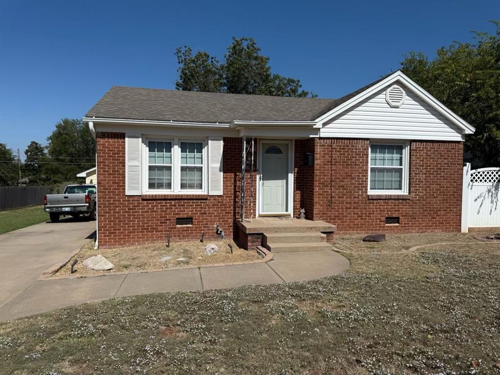 Enter into a two-bed with 1 bathroom home.  The addition is a laundry room that adds itself to an office or study.  The additional garage is large and will hold two cars beside each other.  The additional area in the back of the yard is covered with an ivy fence.