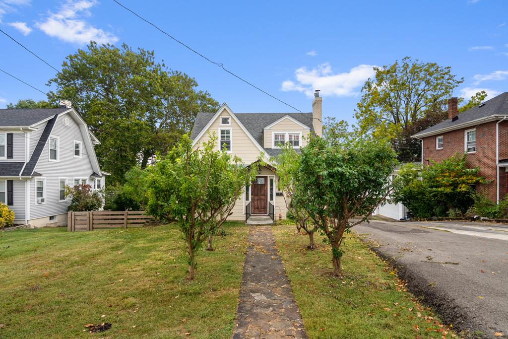 Step into timeless character with this completely refreshed Tudor-inspired residence nestled in Wytheville's historic district. Sitting on a generous half-acre, the property boasts a private fenced yard and lush, professional landscaping accented by mature fruit trees—including plums and peaches. Inside, you'll find four bedrooms plus an additional bonus room upstairs, offering flexible living space. Major updates include a newer HVAC system, newly added second-floor bath, remodeled kitchen, upgraded electrical, and fresh finishes throughout. With its prime location just blocks from downtown, close to schools, parks and shopping, and only minutes to I-81, this home combines classic charm with modern convenience