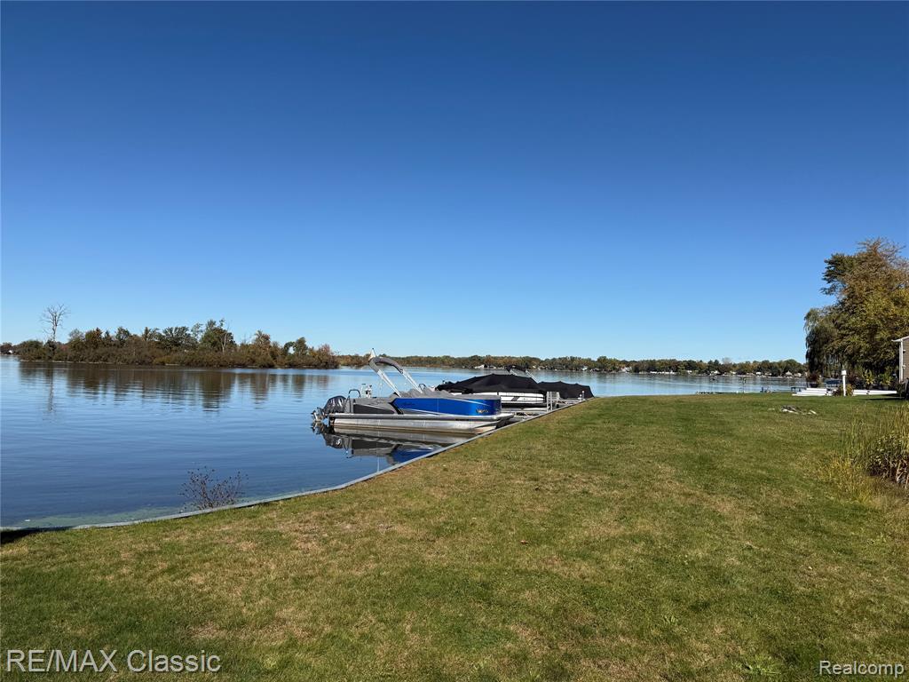 Deeded boat dock on All sports Lake Ponemah new construction basement is in still time to pick out some of your finishes. Model is available to see and we have started another custom lake view home now. Build now and be on the lake for Summer 2026. Cottage Cove subdivision has deeded boat docking and you get access to all 3 lakes -Ponemah, Tupper, and Squaw with great fishing, swimming, skiing, floating, kayaking, ice skating & snowmobiling for year round fun.  Digging basement now. Model next door available to walk through but is sold.This 2100 sq ft built craftsman style cottage home offers luxury and charm, perfectly situated in a quiet and friendly community, You can enjoy the breathtaking views of Ponemah or hop in the boat to explore all that the chain of lakes has to offer. This stunning home features an open floor plan Great room Kitchen & dining all have a view to the water with a door wall to your covered balcony deck as well. Kitchen features walk in pantry & all granite with island bar.The large master suite with full ceramic bathroom. 2 other generously sized bedrooms and a laundry room upstairs are sure to please. Full basement is perfect for finishing or storage of your lake toys. Whether your boating, swimming, or entertaining on the deck overlooking the water, this home offers a lakeside lifestyle close to restaurants, bars, shopping and freeways! Other lots available here and in the surrounding area's Model ready to view in Liberty Shores across from lake Ponemah