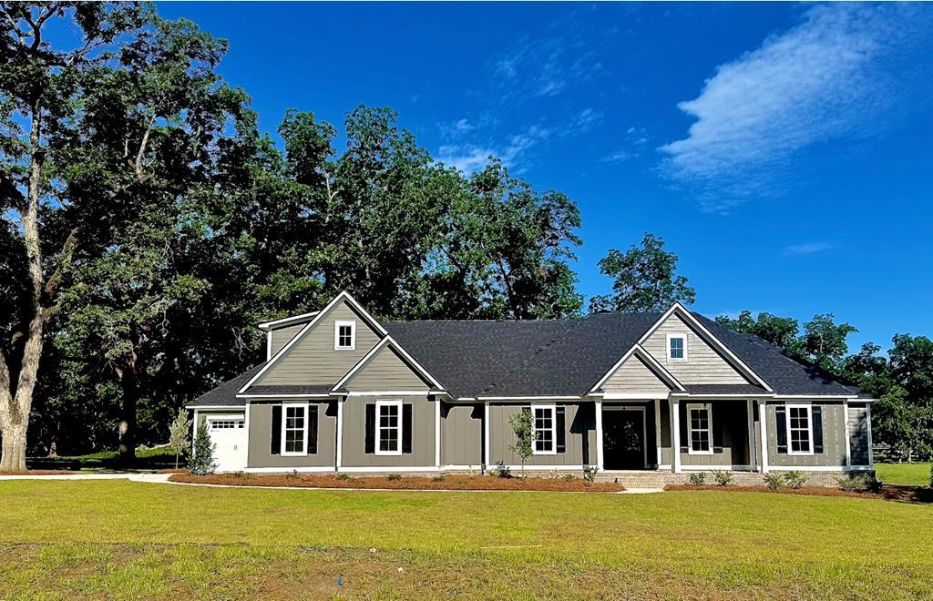 Beautiful Home on a full acre lot located in the new Pecan Farms Subdivision! This 4 bedroom, and 3 full bath home is built by Hendrix Construction. Plenty of room with 3005 heated sf! (4287 sf under roof). Ten foot ceilings. Eight foot interior & exterior doors. This home features coffered ceilings, large kitchen island, custom cabinets, quartz countertops, 36" gas cooktop, wall oven, dishwasher, microwave & refrigerator. Breakfast area & separate dining area! This home features classic design with modern touches. Matte black hardware throughout the home. Living room features a modern electric fireplace. Master bath has tiled shower & stand alone tub. Large walk in closets with wood shelving. Jack & Jill guest bath has tiled tub/shower with dual sinks. Large bonus room located upstairs. Exterior of home has board and batten siding & brick. Architectural shingles. Fully irrigated & landscaped yard with mature Pecan Trees!