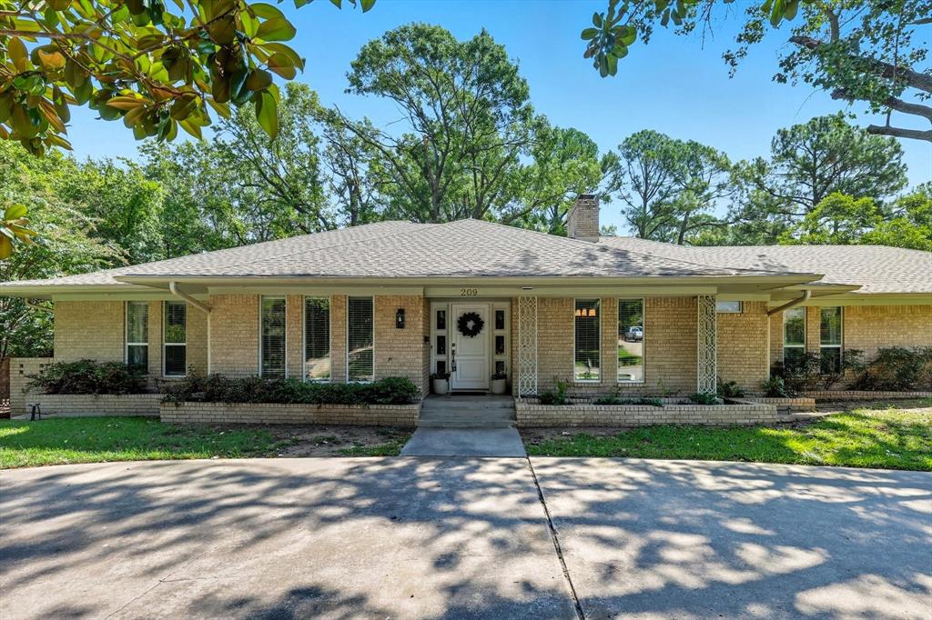 Discover this beautifully updated ranch-style home nestled on a .47-acre corner lot shaded by mature trees in the heart of Southridge. Offering 3 spacious bedrooms, 3 full bathrooms, and 2,846 sq. ft. of living space, this residence blends timeless charm with modern comforts. Hardwood floors flow throughout the home, complementing a light-filled interior with a thoughtful floor plan. The inviting living room features soaring ceilings with exposed wood beams, recessed lighting, and a white brick fireplace, creating a warm centerpiece for gatherings. The formal dining room and dedicated office provide flexible spaces for today’s lifestyle. The kitchen is designed for both style and function with granite counters, stainless steel appliances, double ovens, and ample cabinetry. Retreat to the covered back patio for year-round entertaining overlooking a large backyard with plenty of room for kids to roam. An oversized two-car garage offers incredible versatility as a workshop or hobby space in addition to the attached garage. Located minutes from shopping, dining, parks, and UNT, this property offers the rare combination of space, comfort, and convenience in a highly desirable location.
