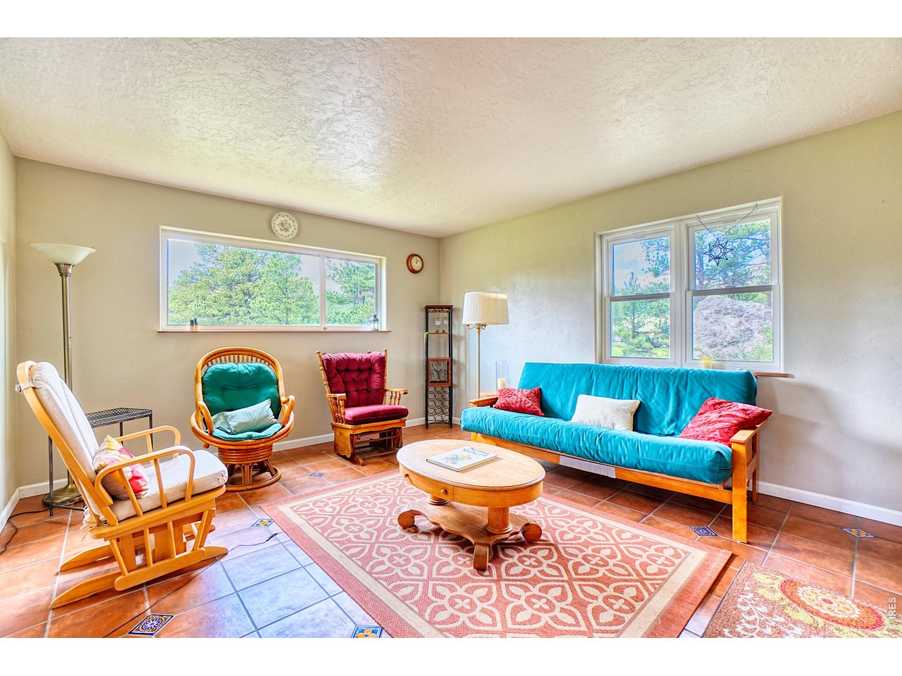 Fabulous opportunity to live on the property while you build your dream home on this gorgeous 4.89 acre lot! Sweet bunkhouse with electric permitted and installed and septic ready to be connected. Fun seasonal yurt is great for guests or spreading out. Seller has loved this location as a family getaway spot and the previous owner used it as vacation rental. This great property features a custom one-bedroom cabin that easily sleeps 4 to 6, a spacious Yurt with living and sleeping space, a large outbuilding for cooking and storage, and an outhouse and separate bathhouse - both with compostable toilets- offering convenience and rustic charm. The cabin features recently permitted electric, a small solar array, metal roof, cement-board siding and trim, double pane windows, tile and bamboo flooring, superior insulation, and a huge walk-in crawlspace for storage. The lovely covered composite deck is a fun place to hang out and enjoy the view. You'll love the spacious 20' in diameter Yurt with deck and plenty of living and sleeping space. With a newly installed septic vault, the only thing left is to add water via a cistern or well and you've got a fully functioning basecamp. Plus, there's plenty of room for RVs or tent camping. Hardwoods, evergreens, open meadow areas, and rock outcrops offer great potential for a permanent homestead or keep it as a vacation property. With easy year-round access and limitless possibilities, this special property is a fantastic value offering a cozy place to unwind, entertain, or stay while you design your dream home. Don't miss out on this must-see gem! Contact us today for detailed information and to schedule your personal tour.