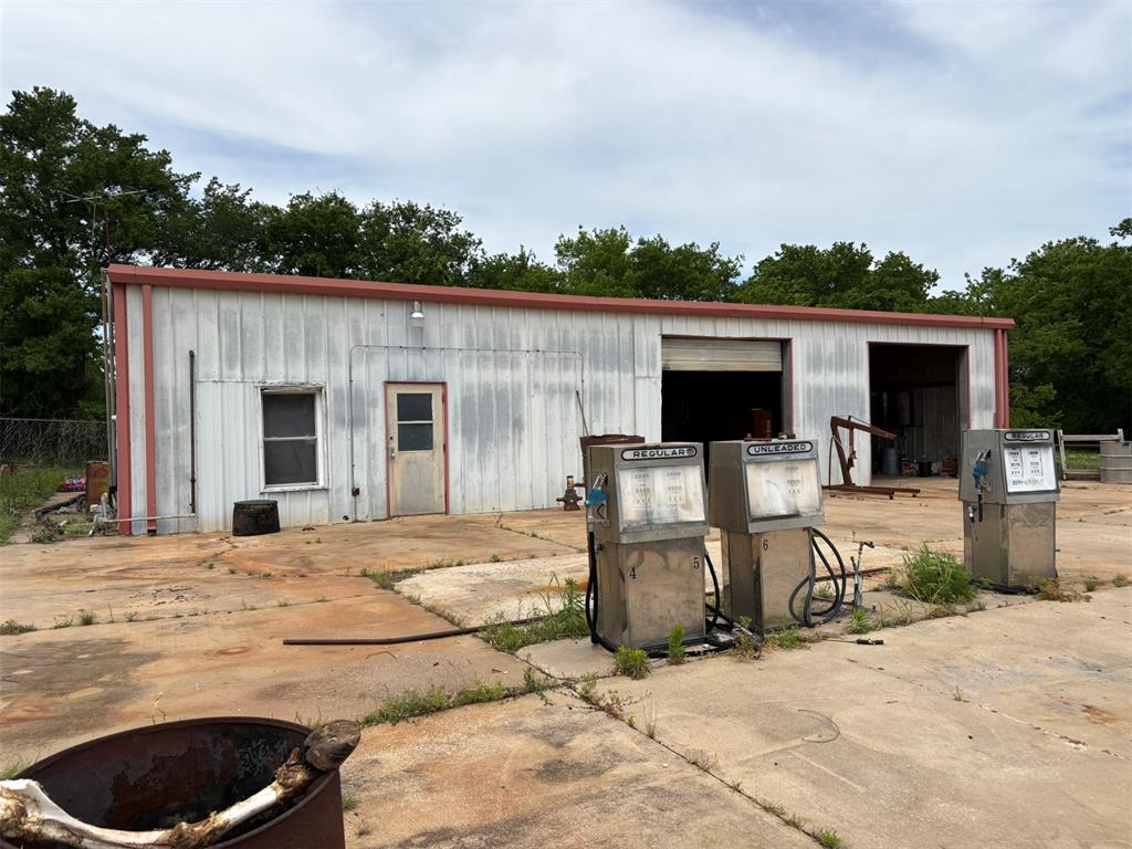 This versatile 2,000 sqft commercial gas station property offers a rare opportunity for owner-operators or investors alike. Featuring two mechanics bays and a commercial vehicle hydraulic lift, the space is well-equipped for automotive service and repair operations. The site includes two original underground gas tanks, providing added functionality for fuel service potential. Inside, you'll find both front and back office spaces, complete with cabinets and a sink, creating an efficient workflow for administrative and customer service needs. A full bathroom adds convenience for staff and clients. With its practical layout and essential infrastructure already in place, this property is primed for a wide range of commercial uses.