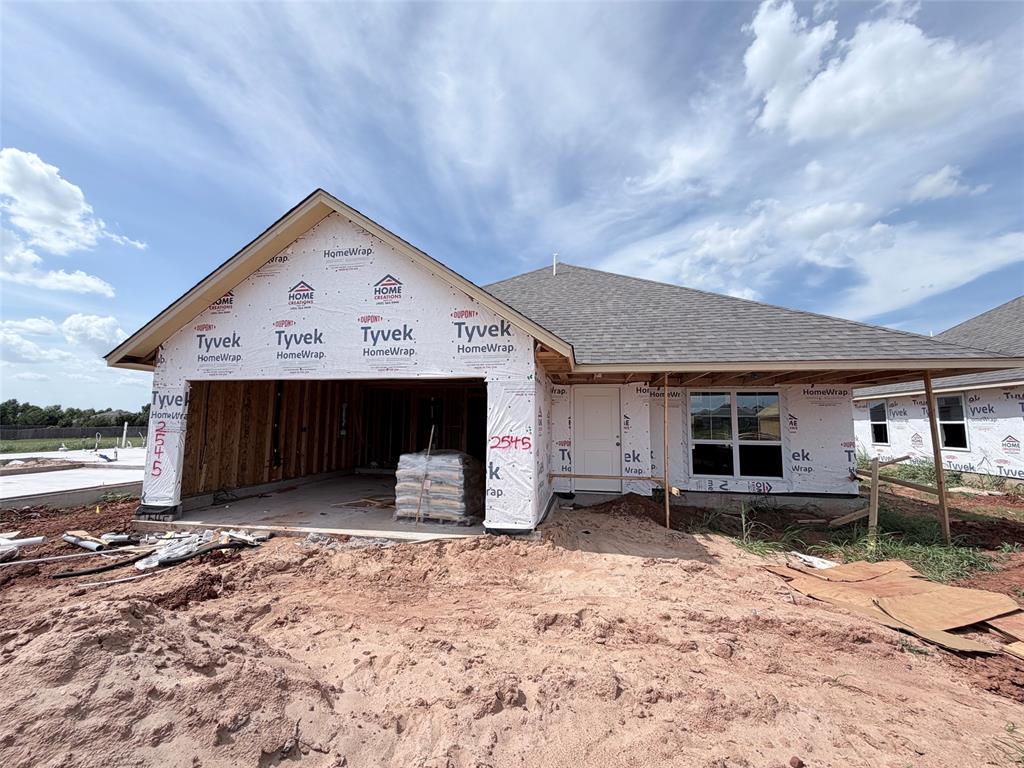 Welcome to this new construction home in Castleberry, offering 1,701 square feet with four bedrooms, two baths, and a two car garage. Designed for everyday comfort and effortless entertaining, the open layout connects the living, dining, and kitchen areas while large windows bring natural light into the main living spaces. A striking fireplace creates a warm focal point for relaxing evenings, while wood look tile flows through the living room, dining area, kitchen, entry, and hall. The kitchen is designed to make daily cooking and gathering enjoyable, featuring custom wood cabinetry, quartz countertops, tiled backsplash, under cabinet lighting, a large island, decorative vent hood, and built in stainless steel Samsung appliances. The spacious primary bedroom offers a relaxing retreat, with a primary bath featuring a garden tub, floor to ceiling tiled shower, raised dual sink vanity, and a generously designed closet with additional seasonal storage. A covered front porch and covered patio extend the living space outdoors. Energy conscious features include a HERS Index rating of 46, 96 percent efficient tankless water heater, Low E windows, radiant barrier roof decking, LED lighting, high efficiency furnace, insulated air conditioning ducts, and attic insulation. Smart home features include an Ecobee programmable WiFi enabled thermostat and WiFi enabled garage door opener with battery backup. The finished two car garage also includes an electric vehicle charging outlet. Included warranties provide additional peace of mind. Castleberry offers a clubhouse with kitchen, dining space, fitness center, resort style pool, playground, sidewalks, and well maintained streets. Located just off 192nd Street between Penn and May in Edmond, this home combines thoughtful design, practical features, and community amenities. Schedule your private tour and experience the possibilities of this new home for yourself.